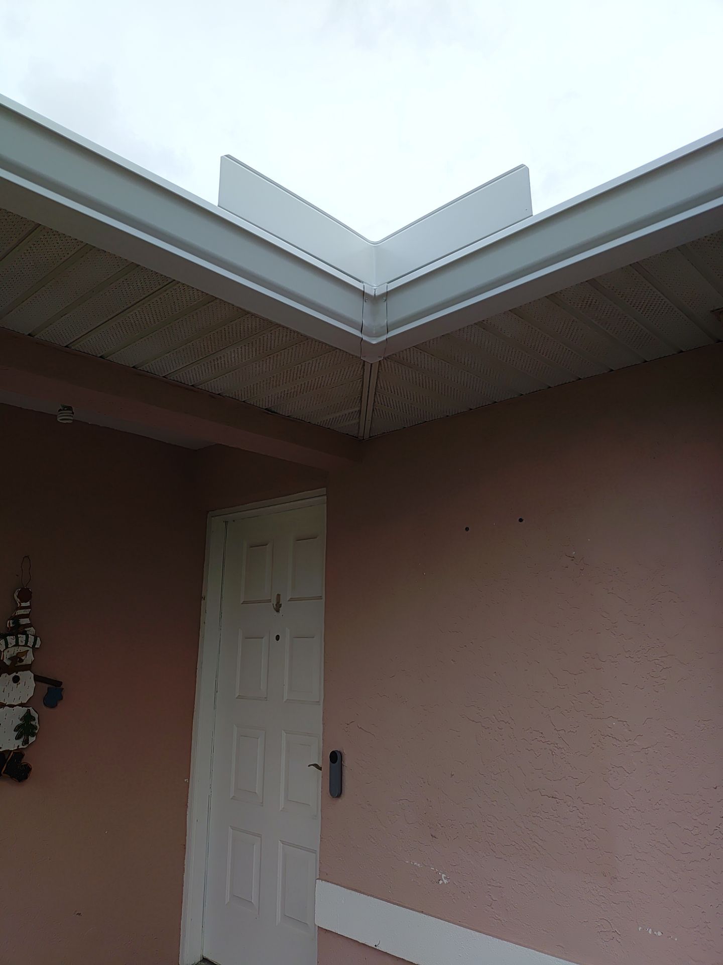 Replace gutter using White Down Spouts in Cape Coral FL by Gutter Professors
