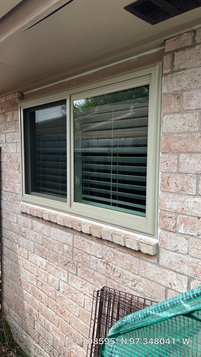 Colored Vinyl Windows to blend into brick by Bayfront Roofing and Construction