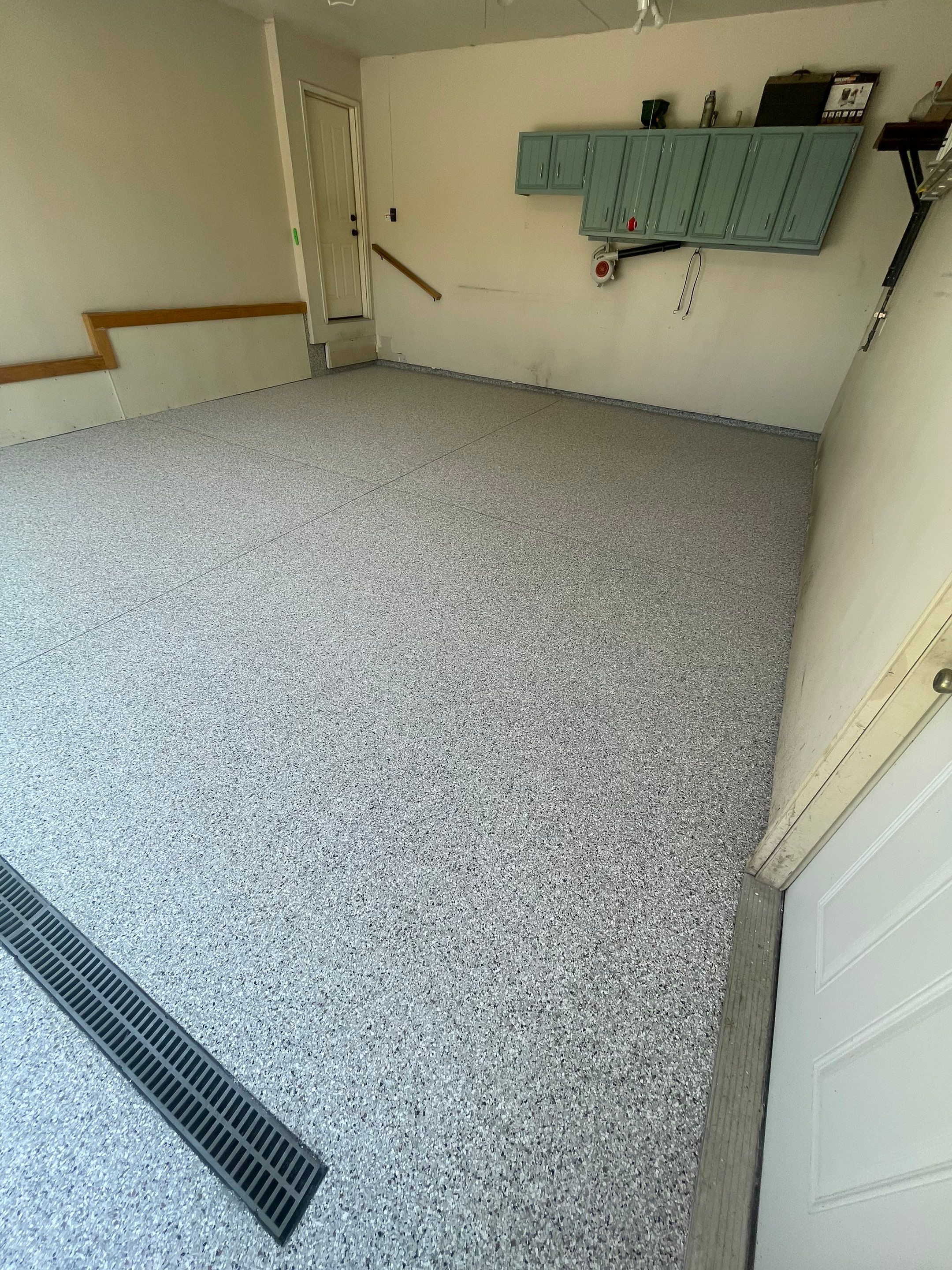Multi-Stall Garage Floor Coating Installation in Sioux Falls by Select Painting, Coatings & Garage Cabinets