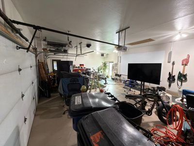 Residential Garage Floor Coating with Grey Speckled Epoxy Finish