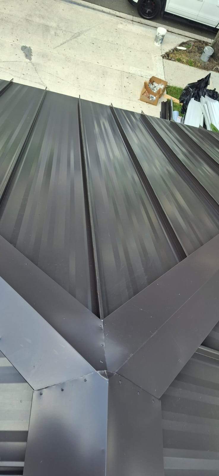 24ga 1.5" Mechanical Seam Dark Bronze by Total Roofing System The Metal Roof Experts