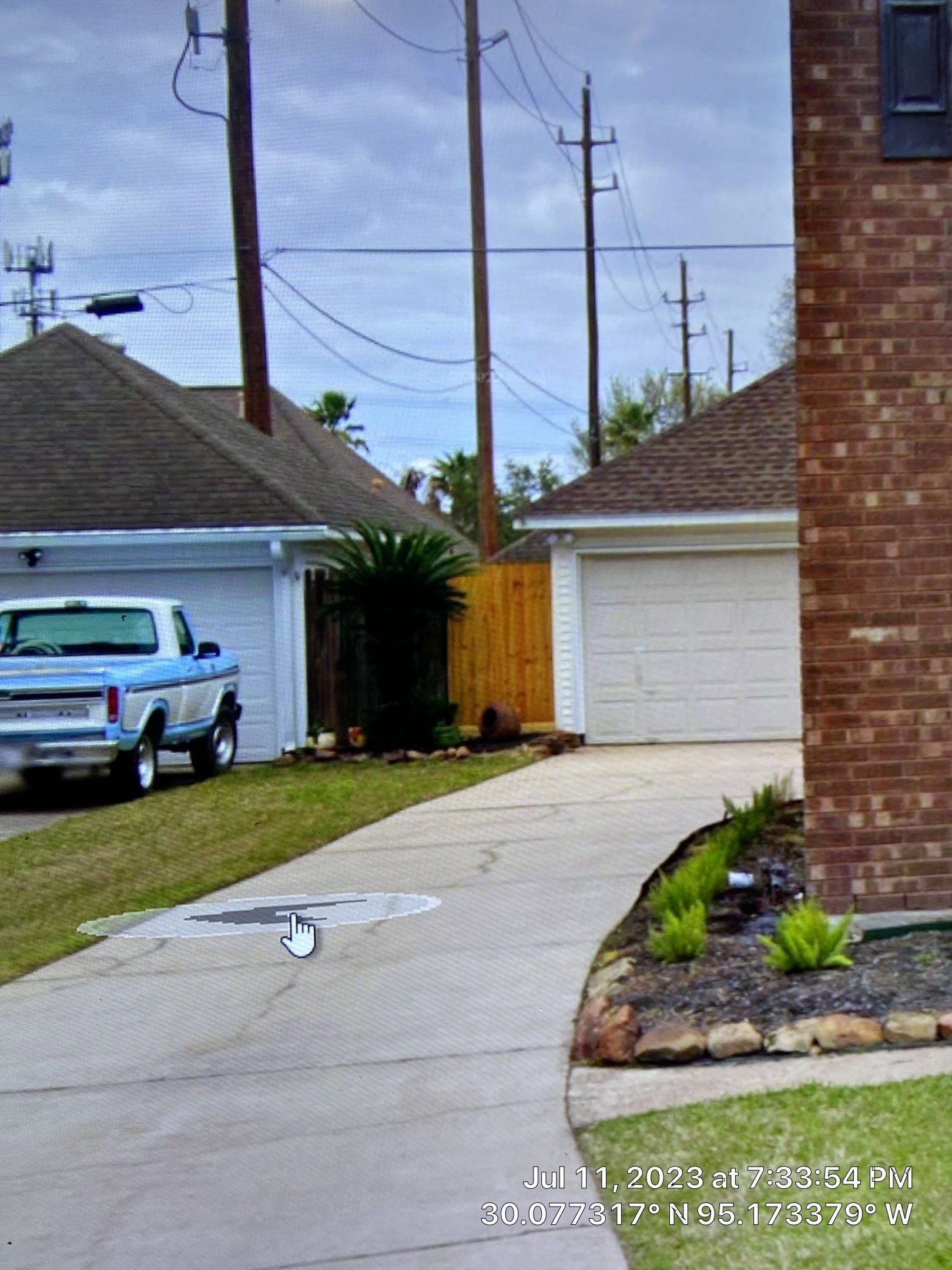 Complete metal driveway gate install with solar powered opener. Metal fence frame with Cedar Pickets by Astro Outdoor Designs 