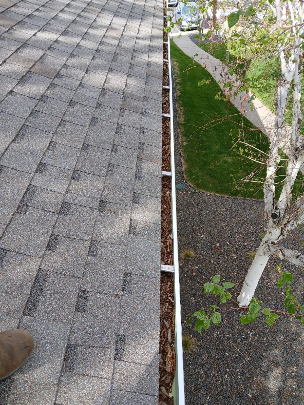 Commercial gutter cleaning Yakima & Tri Cities before photo with filled gutters