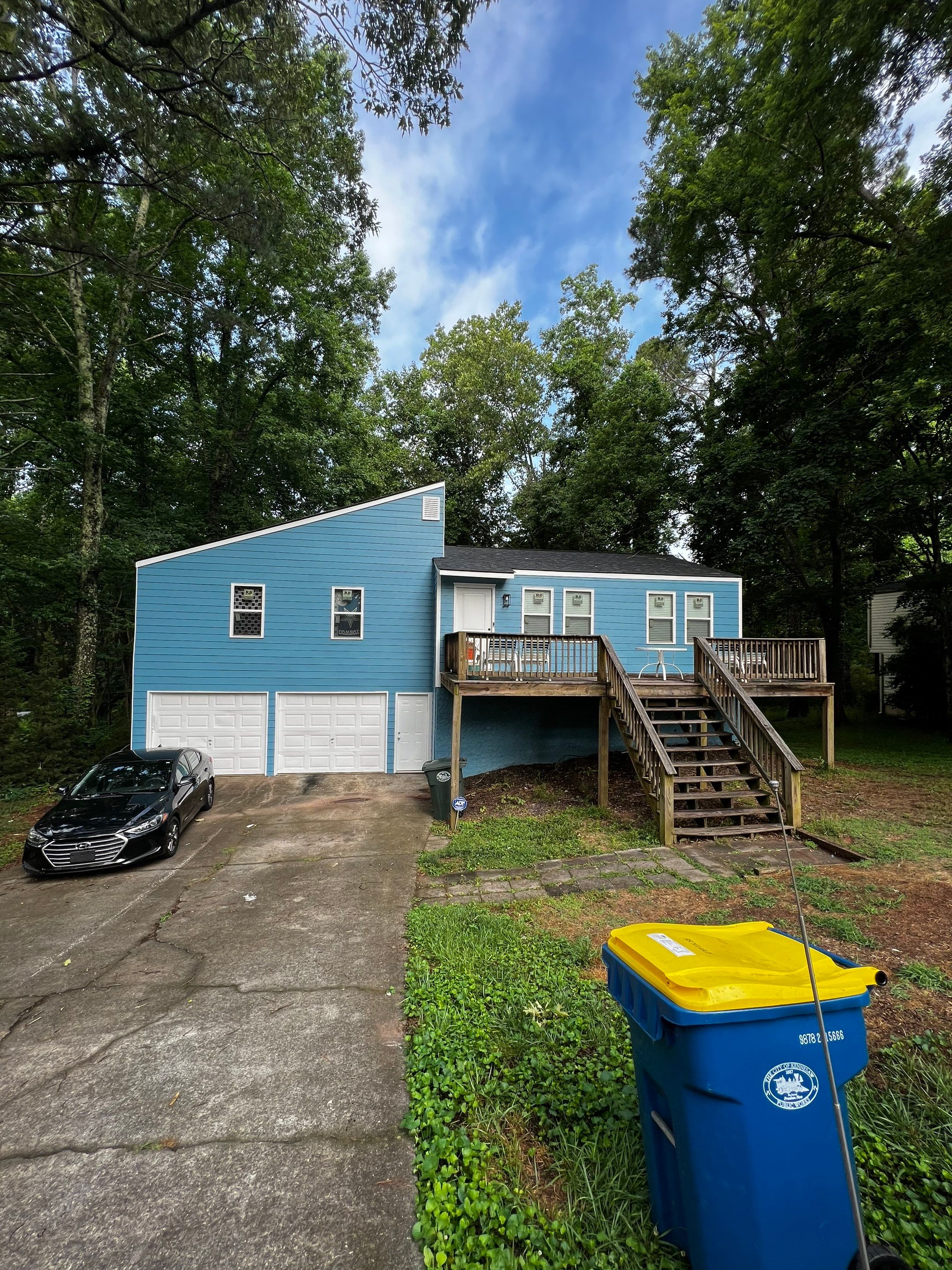 Elevated Wood Deck and Blue Lap Siding Installation in Kennesaw by Swift Home Renovations