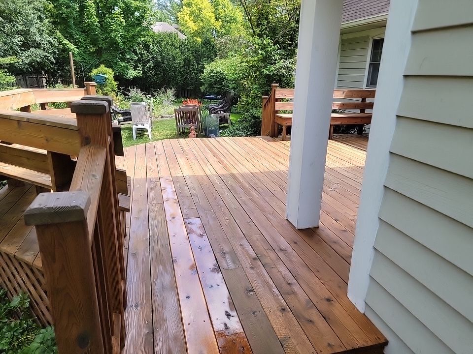 Wood deck cleaning, board replacement and staining by Northern Power Washing LLC.