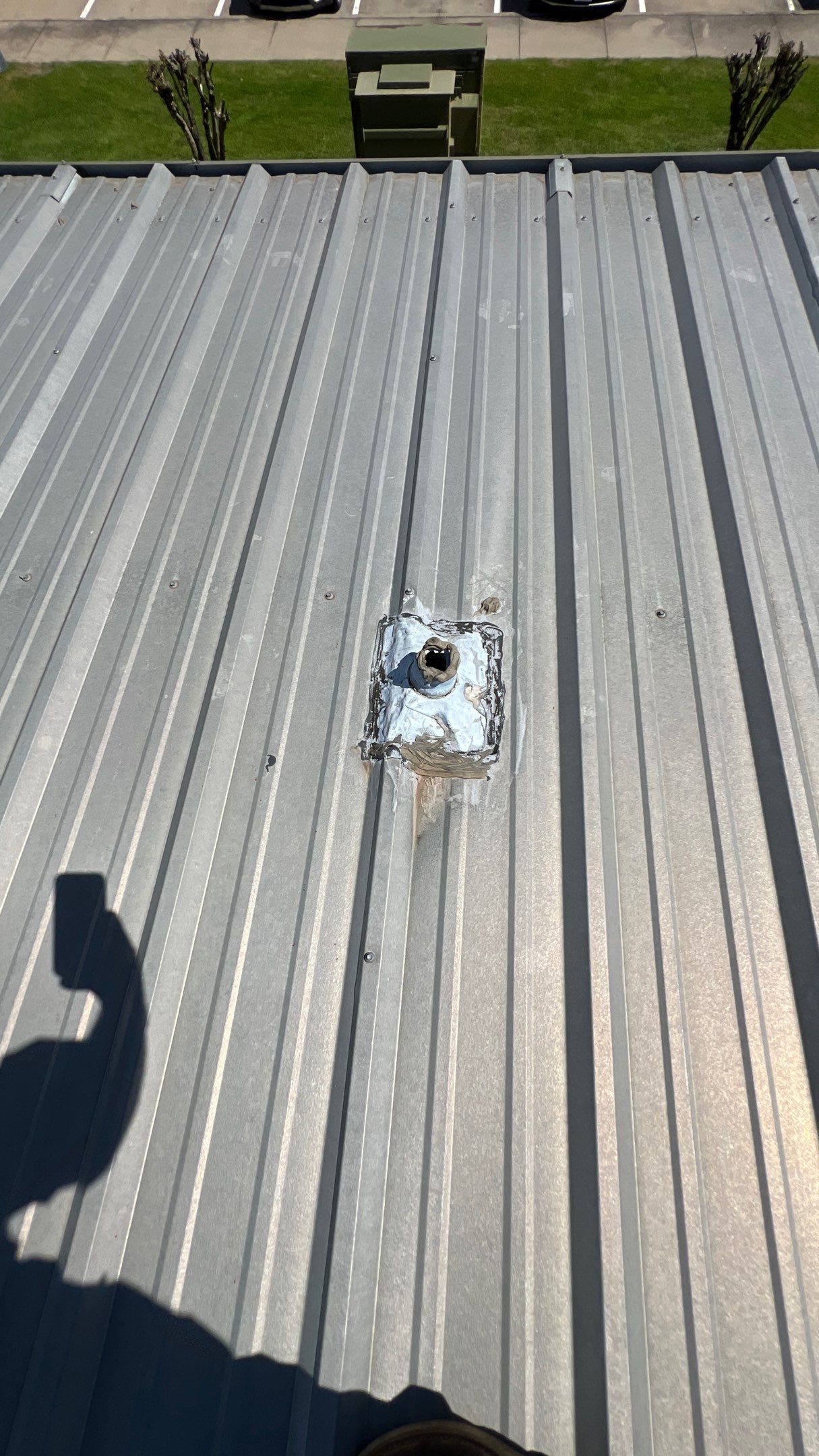 Commercial Roofing Installation using TRP #924 Eterna-Sil Premium Silicone Roof Coating by Harvey Roofing & Construction