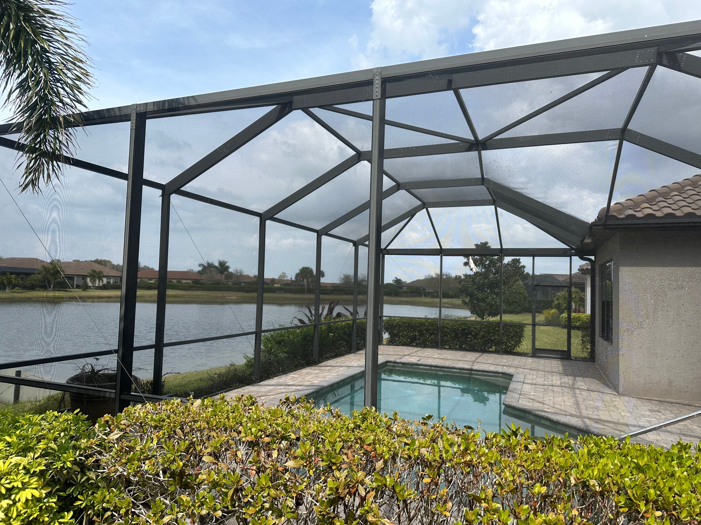 Concrete Tile Roof, Paver Pool Deck, Screen Enclosure & Driveway Cleaning in Artisan Lakes Esplanade, Palmetto, FL | Sunshine AquaWash by Sunshine AquaWash