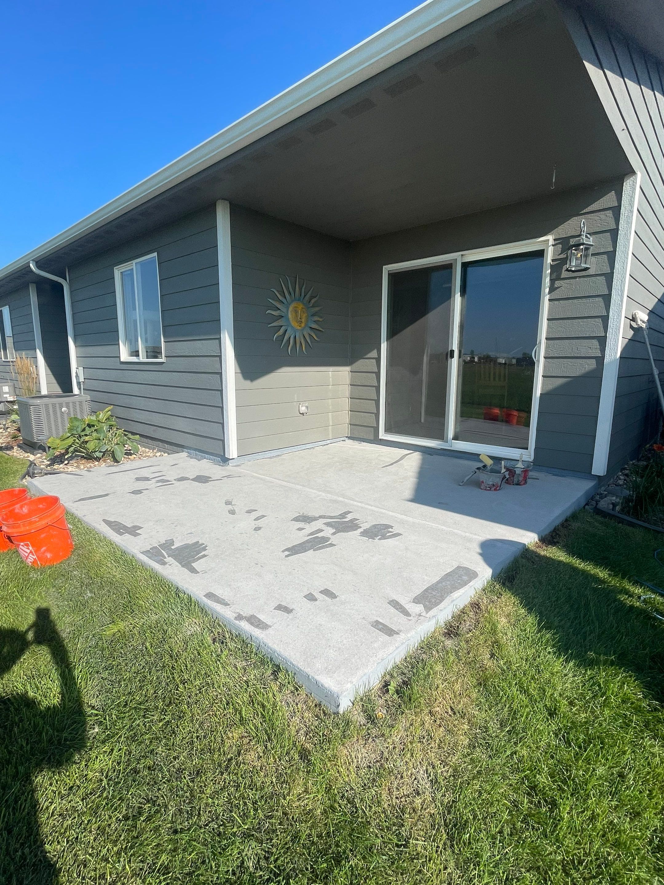 Starry Evening Concrete Patio Coating Installation in Tea by Select Painting, Coatings & Garage Cabinets