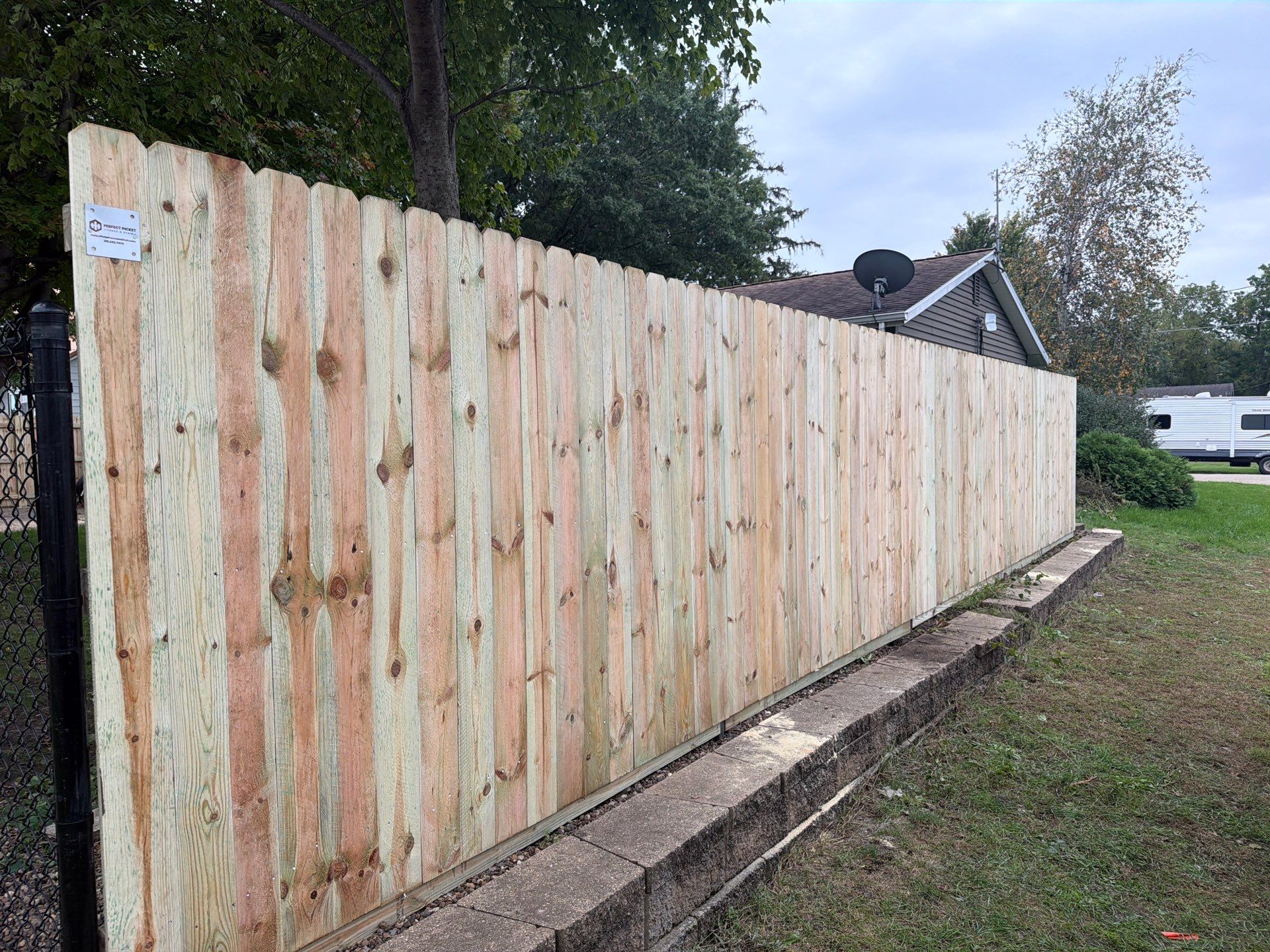 Custom Wood Privacy and Black Chain Link Fence in Hudson by Perfect Picket Fence and Stain