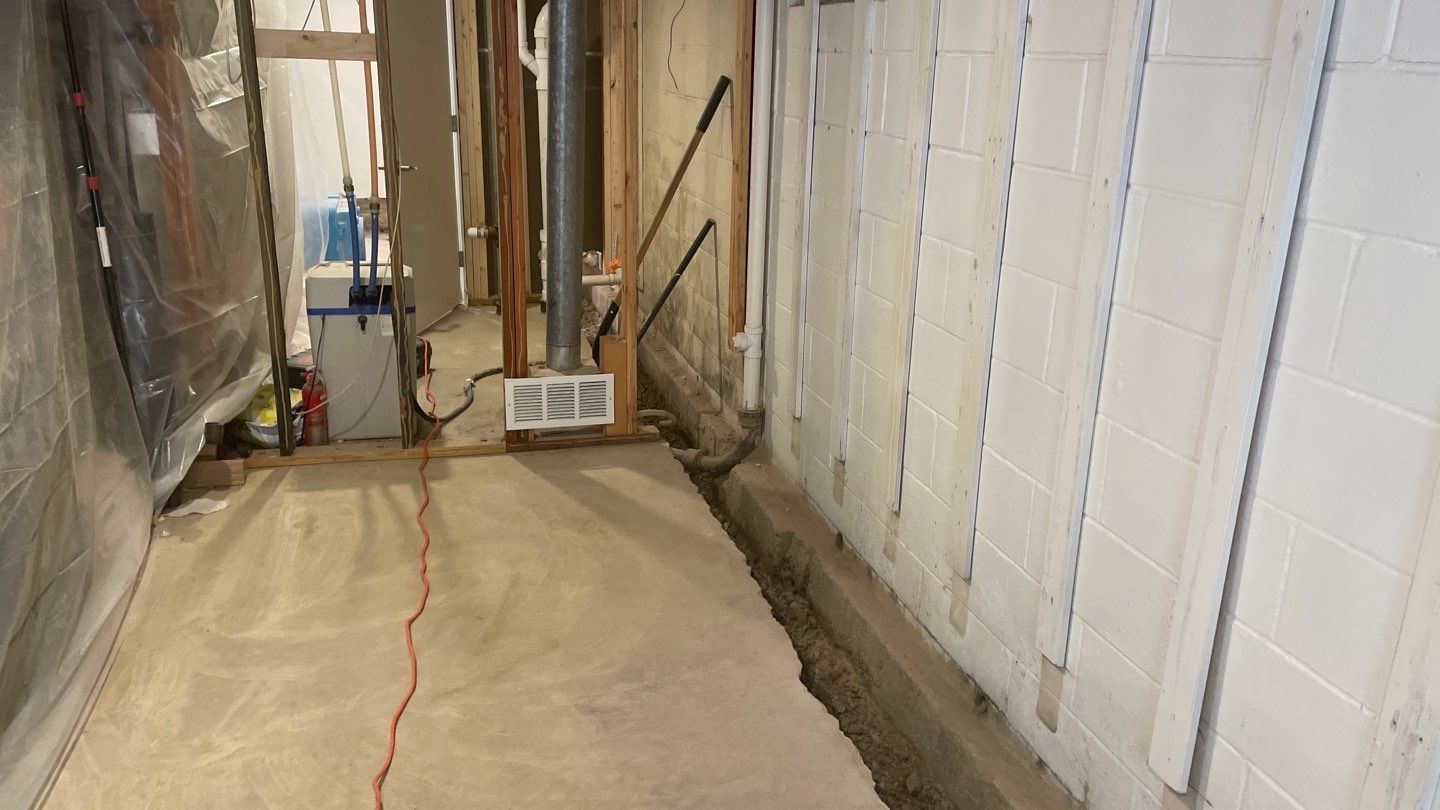 Interior Drain Tile & Buried Discharge in St. Anthony, MN by Waterproofing Northeast