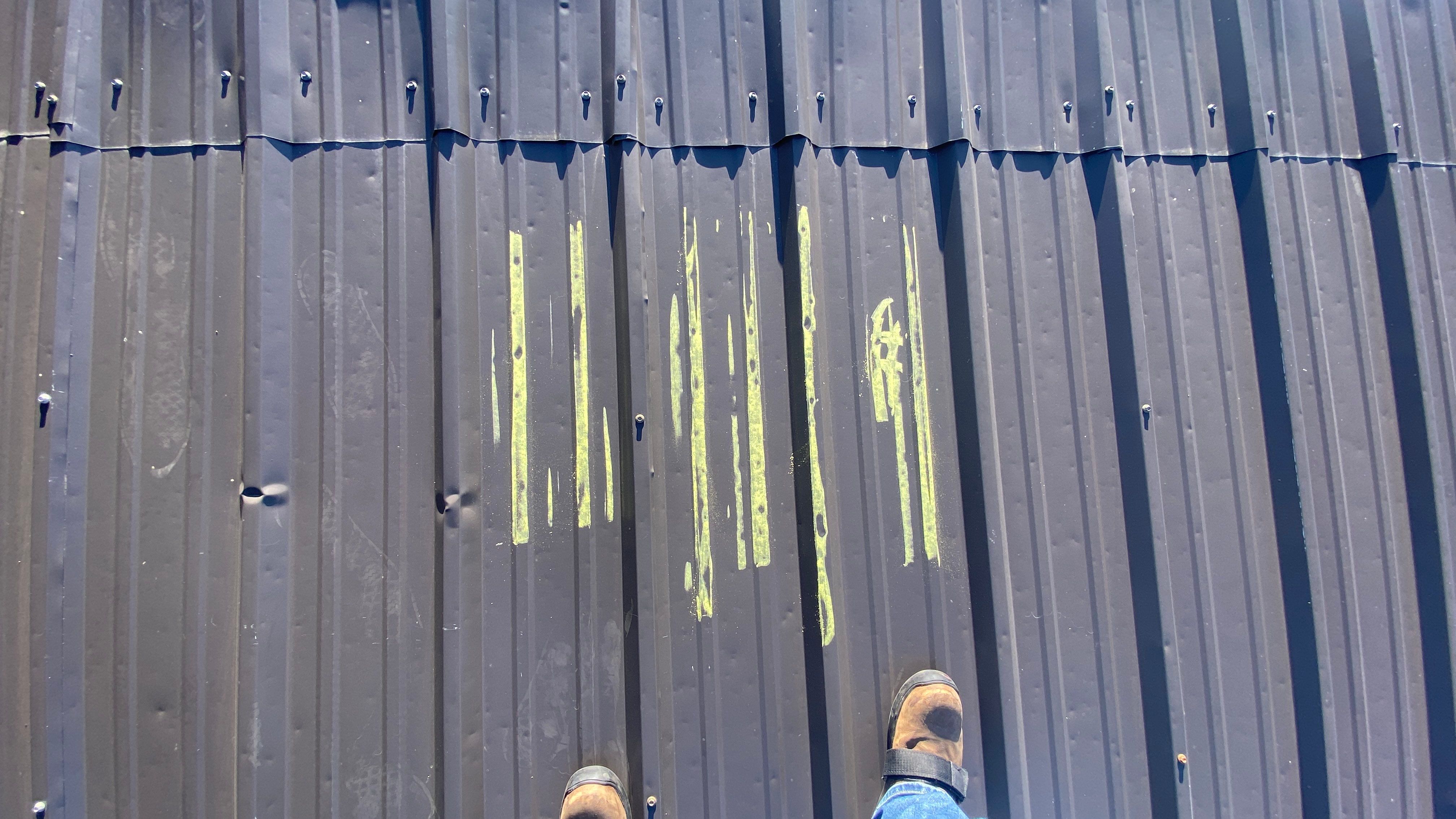Commercial Roofing Installation using  24 GA 2" Seam Metal Retrofin - Buckskin by Action Exteriors