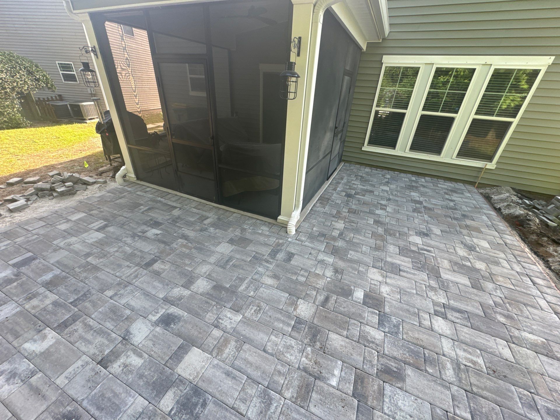 Custom Paver Patio Extension and Circular Fire Pit in Bluffton by Lowcountry Scapes, LLC