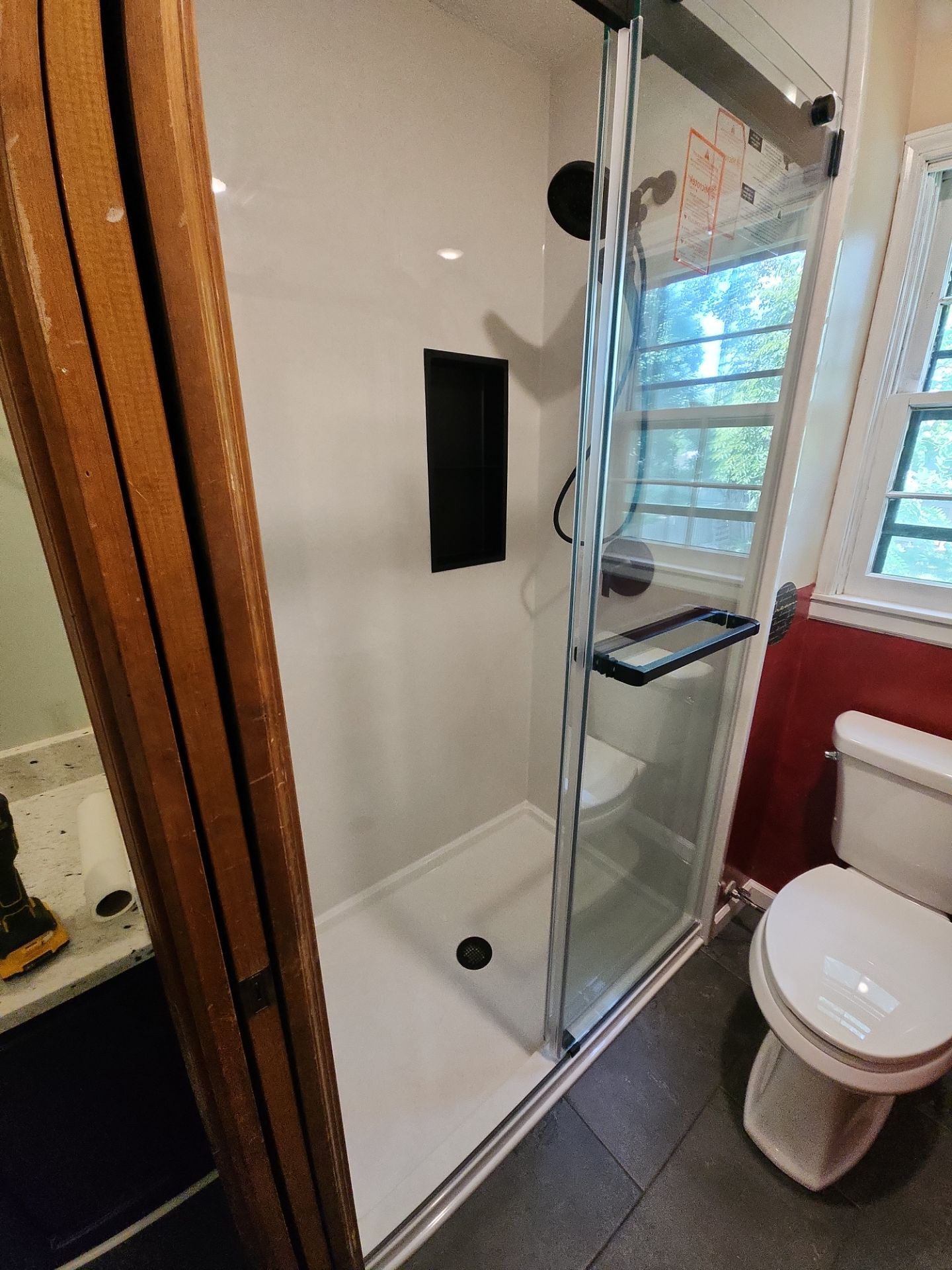 Bathroom Remodel using Tile Floor by The Shower Company