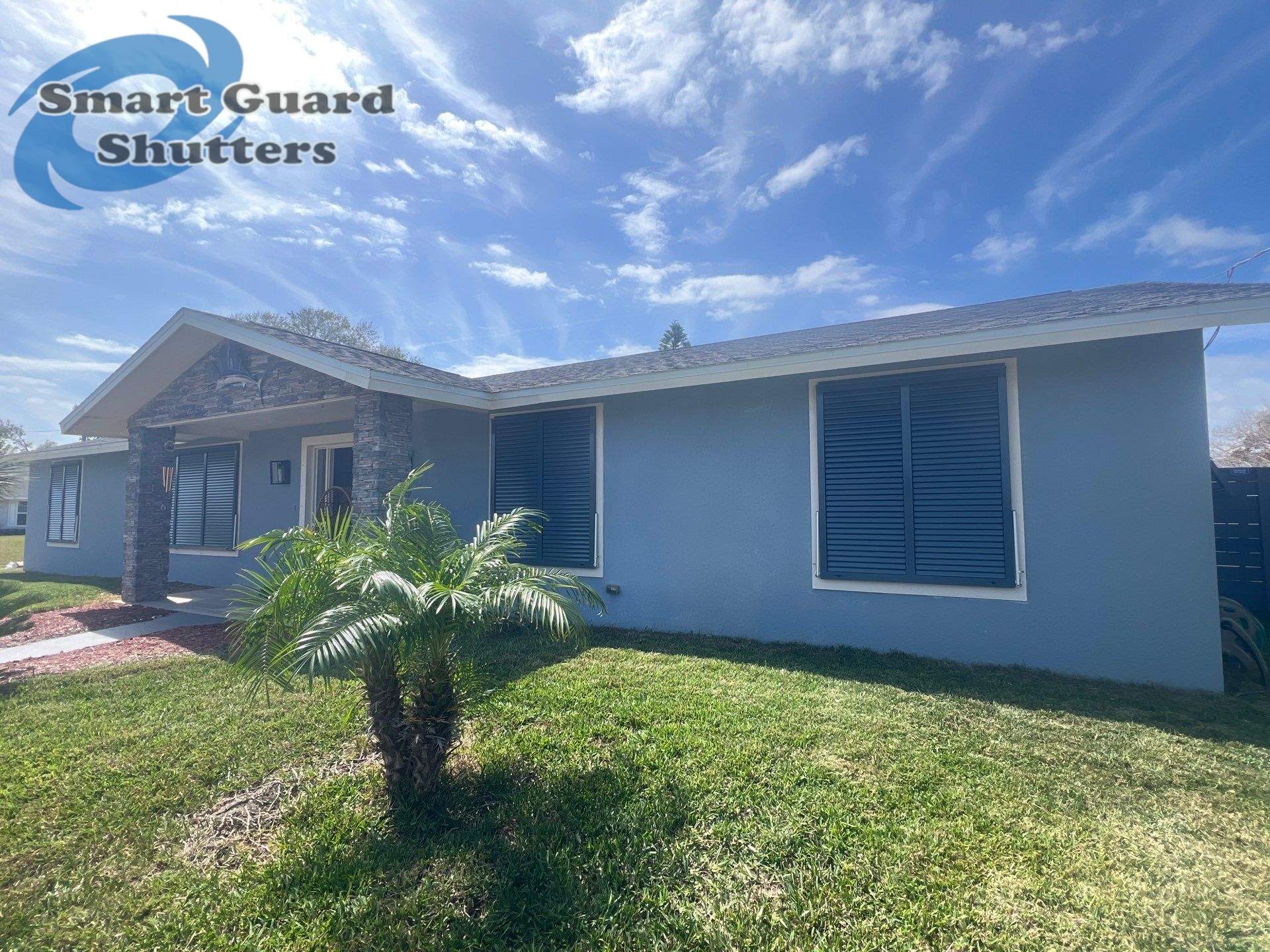 Impact Bahama Shutters in Grey Blue by Smart Guard Shutters