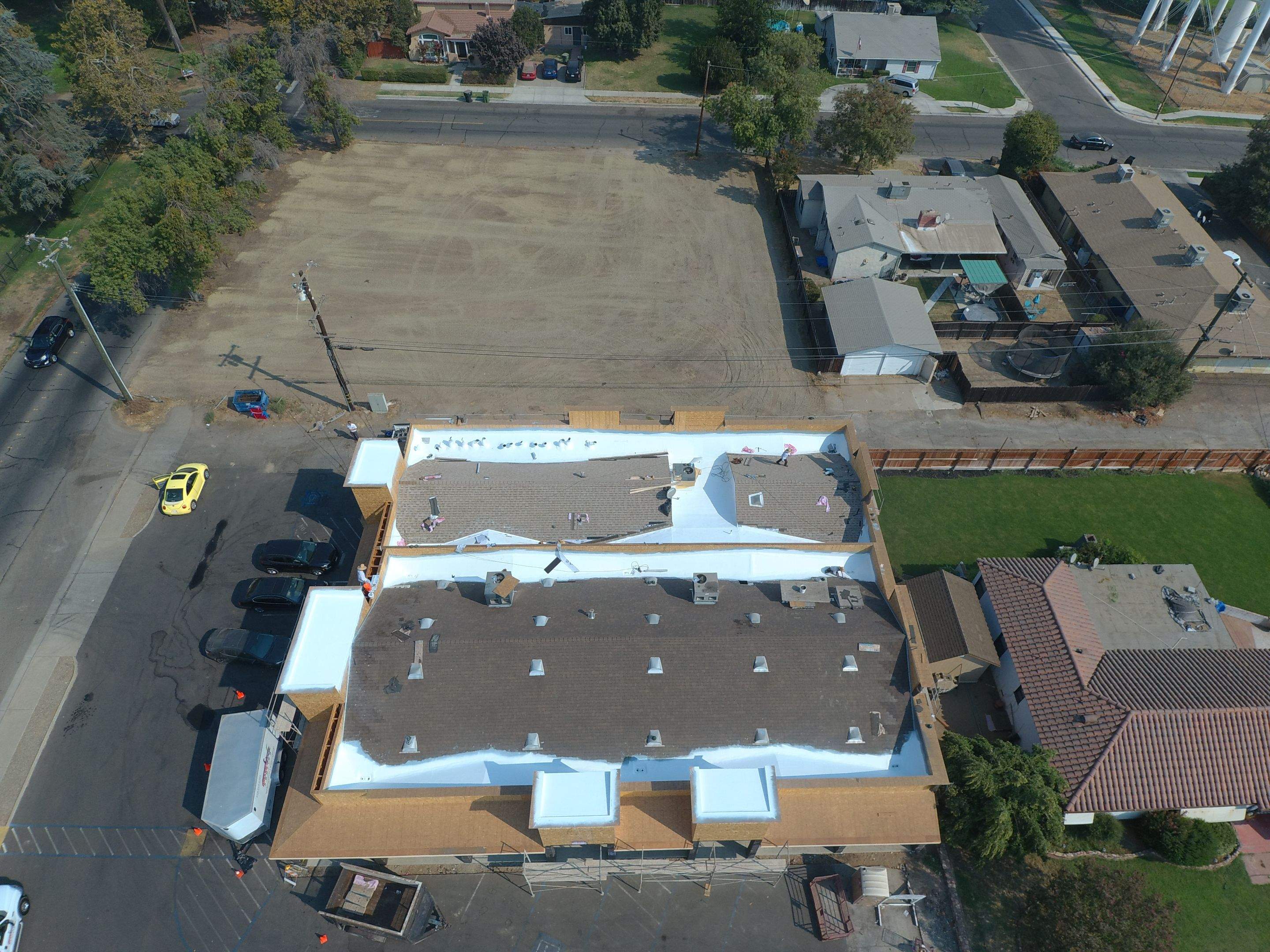 Spray foam and coatings using Conklin Benchmark/PUMA XL coatings and spray foam by Straight Edge Roofing Inc