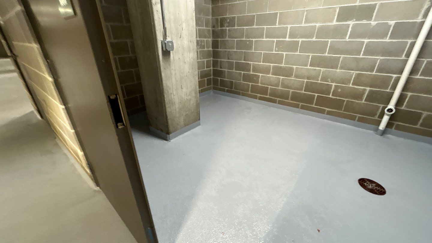 Parking garage using Hot water by Northern Power Washing LLC.