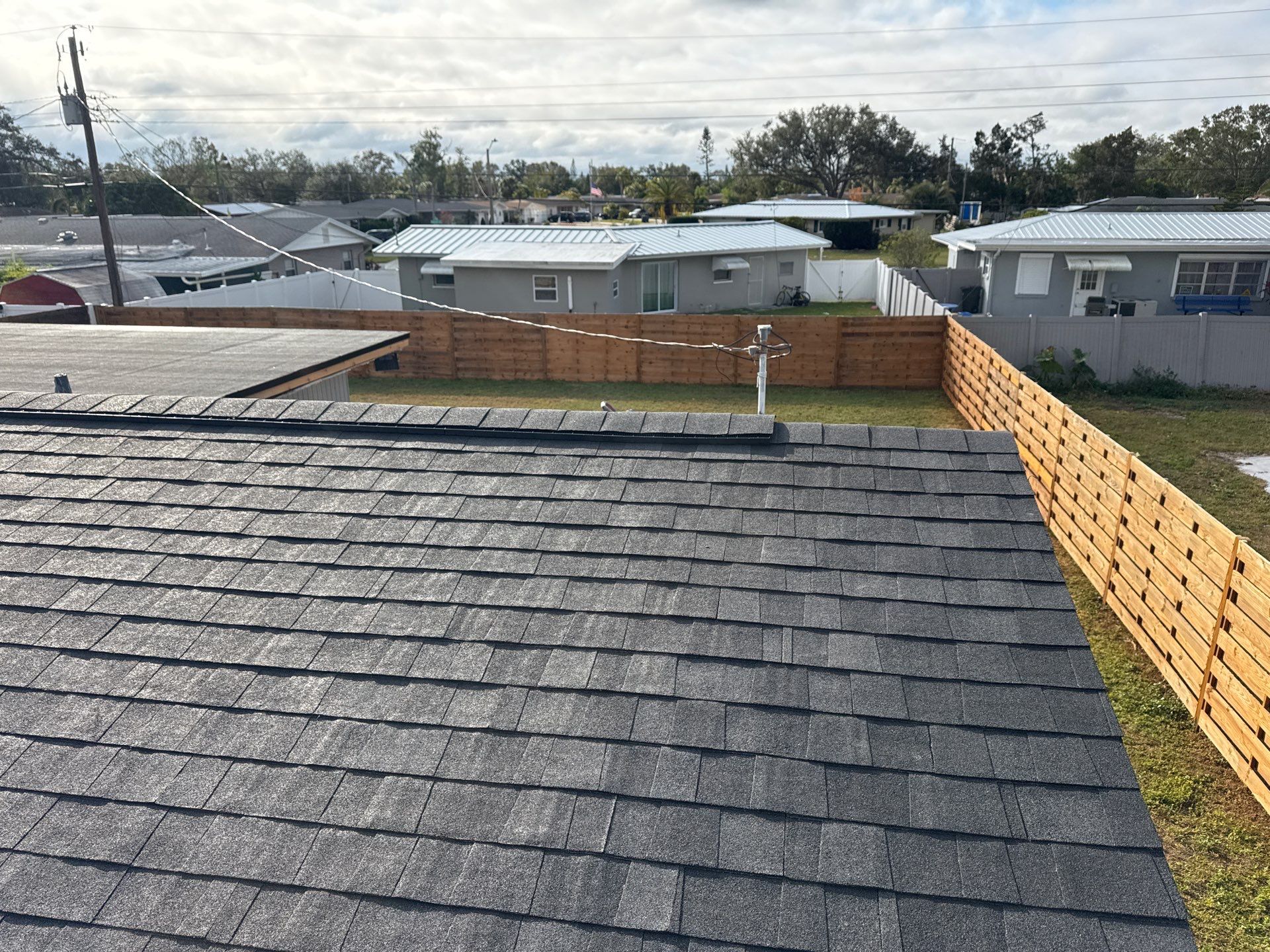 Onyx Black Shingles by Reimagine Roofing