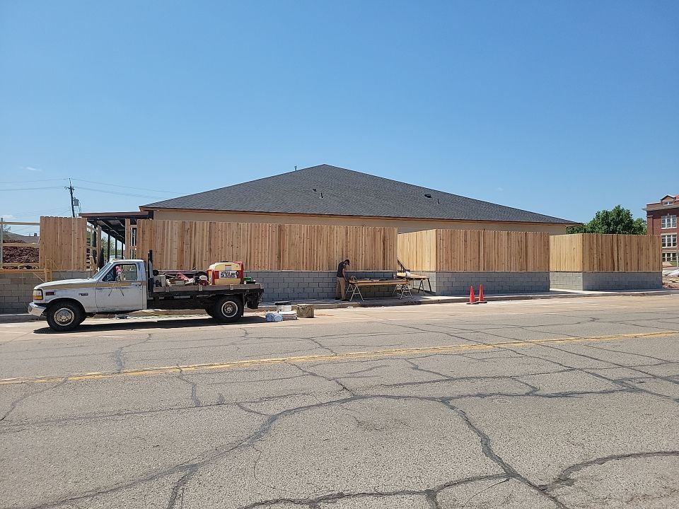 Cedar Fence using Cedar Pickets and Metal Poles by Clays Services Inc
