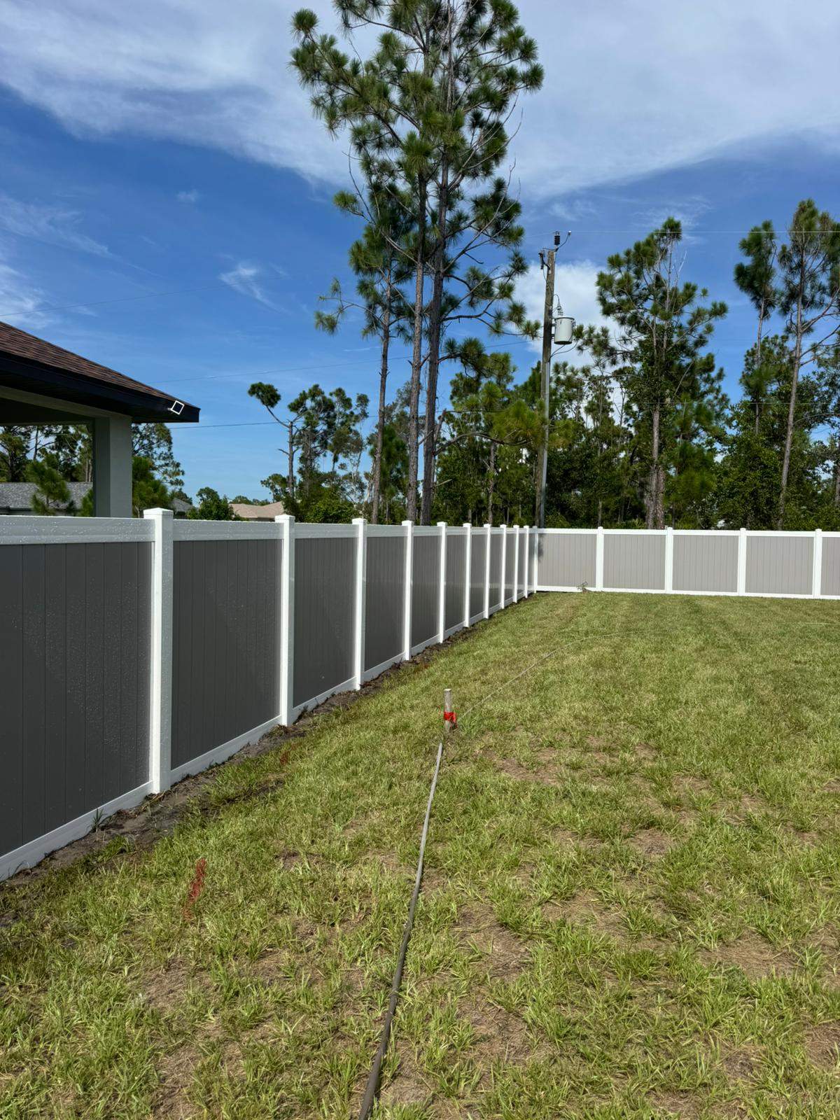 Two-Tone Vinyl Privacy Fence Installation in Port Charlotte by True Fence LLC