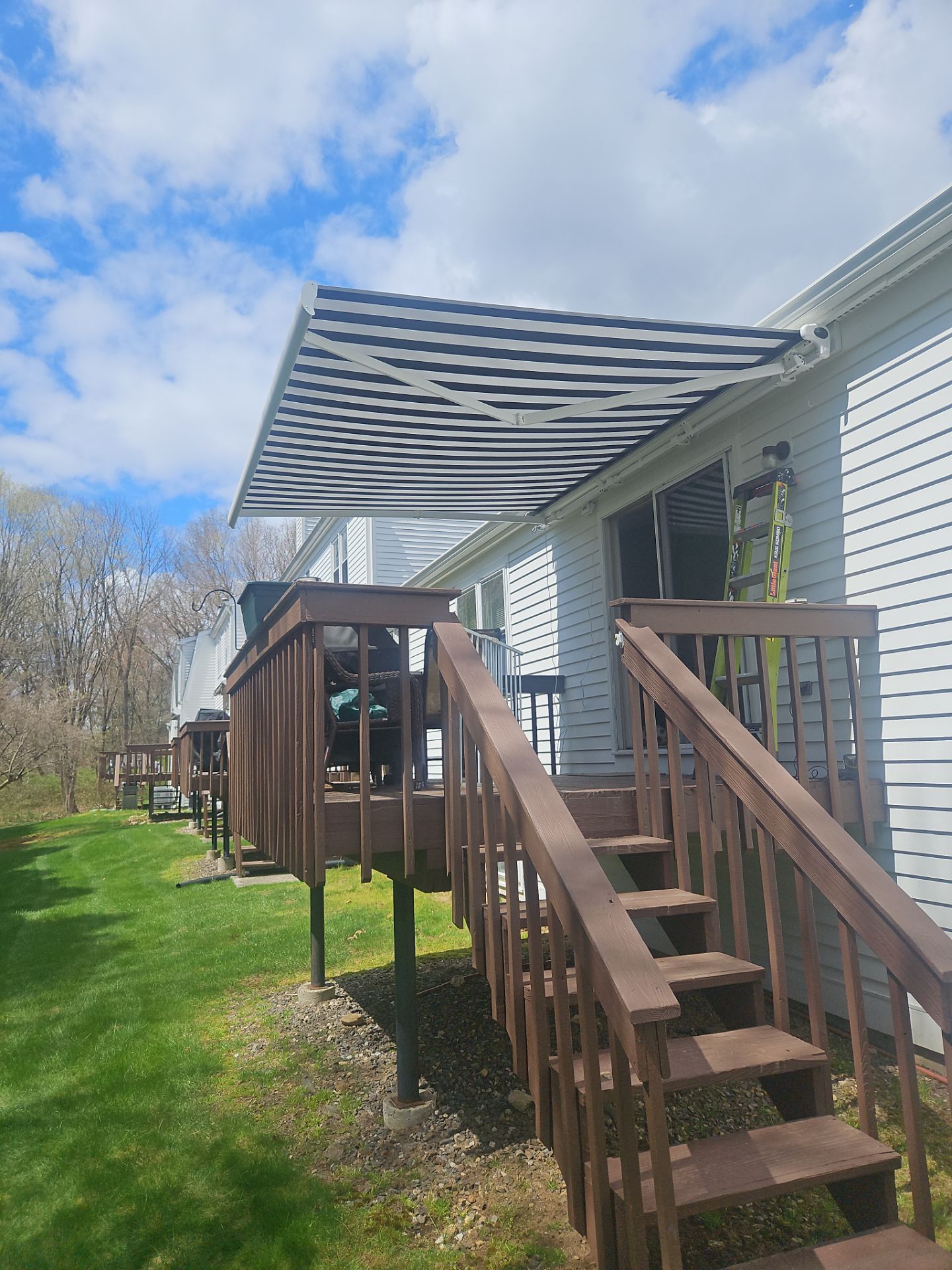 Retractable Awning Installation & Exterior Upgrade by DiGiorgi Roofing and Siding Inc