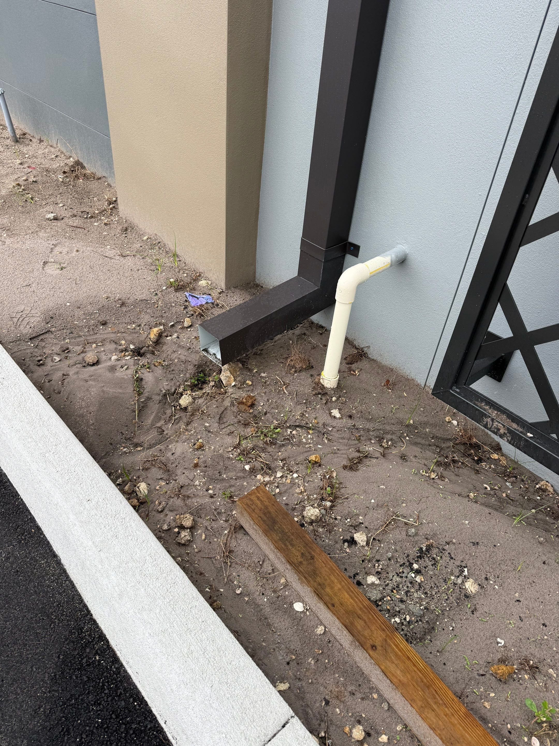 Downspout Installation using collector head in Cape Coral FL by Gutter Professors