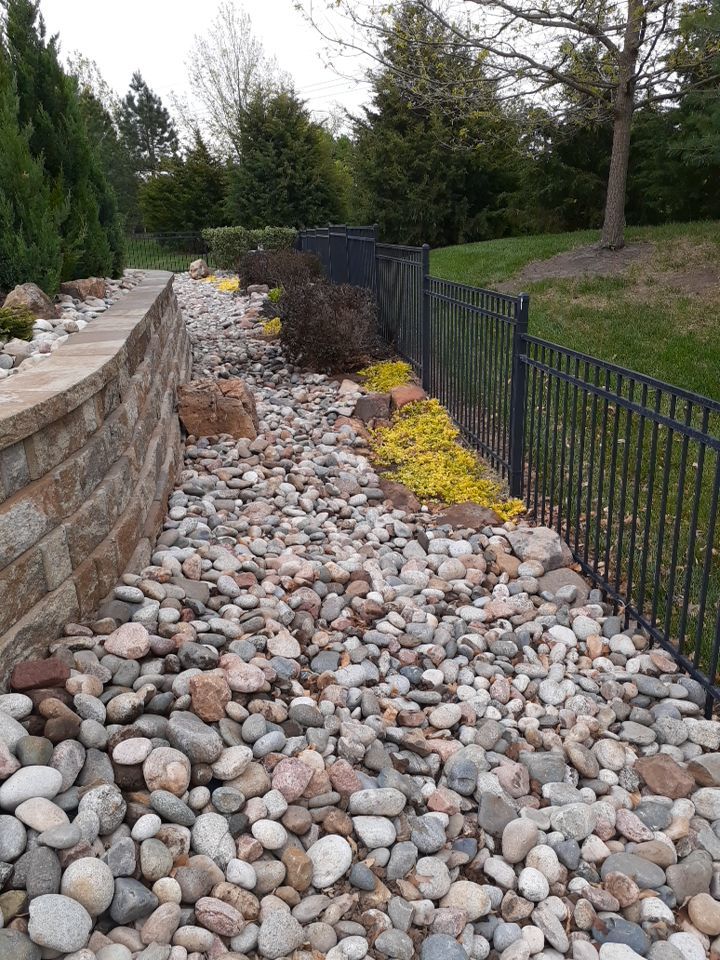 Pool Retaining Wall by LAND ESCAPES LLC