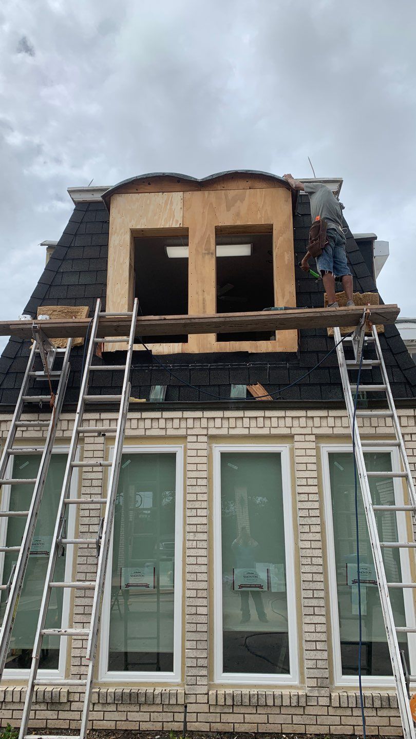 Mansard Charm by Bayfront Roofing and Construction