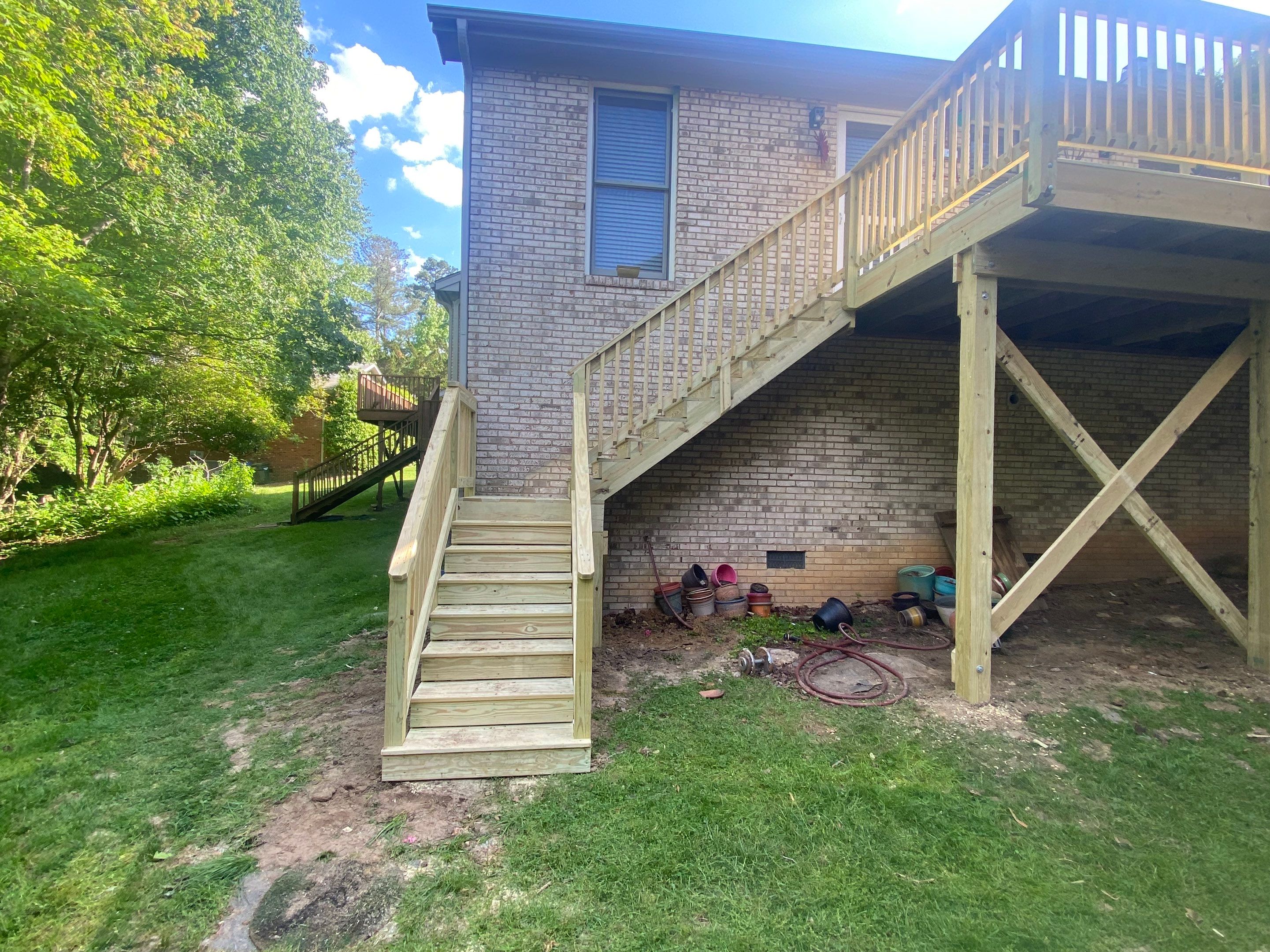 Pressure-Treated Deck Resurfacing and Custom Privacy Railing in Durham by The Remodeling Company
