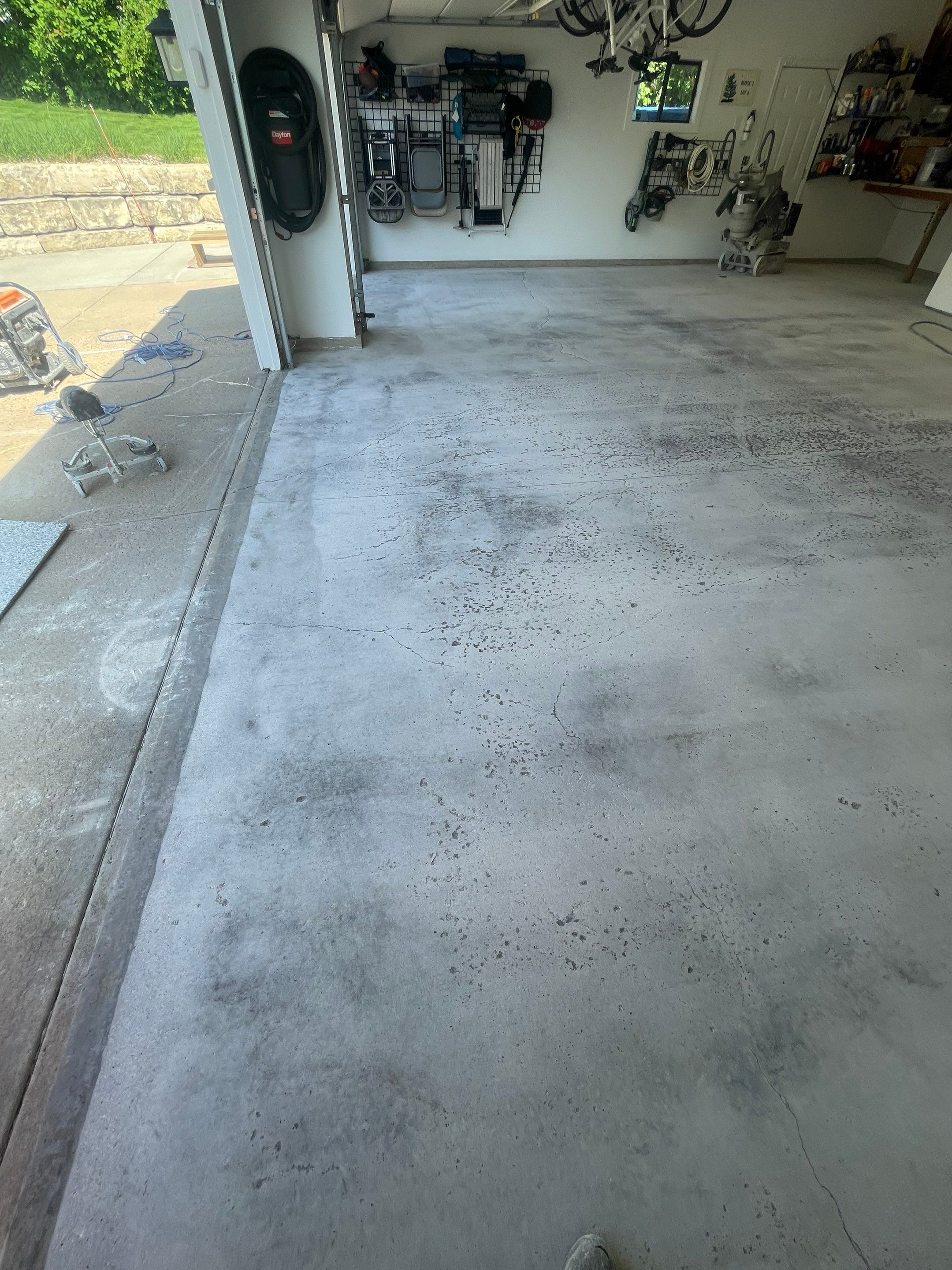Feather Grey Garage Floor Coating Installation in Sioux Falls by Select Painting, Coatings & Garage Cabinets