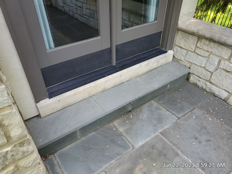 Northbrook, IL stucco home soft wash and stone cleaning by Northern Power Washing LLC.