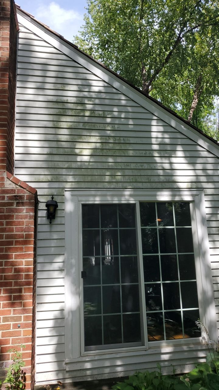 Housewashing  using Algaecide, soft wash soap by Northern Power Washing LLC.