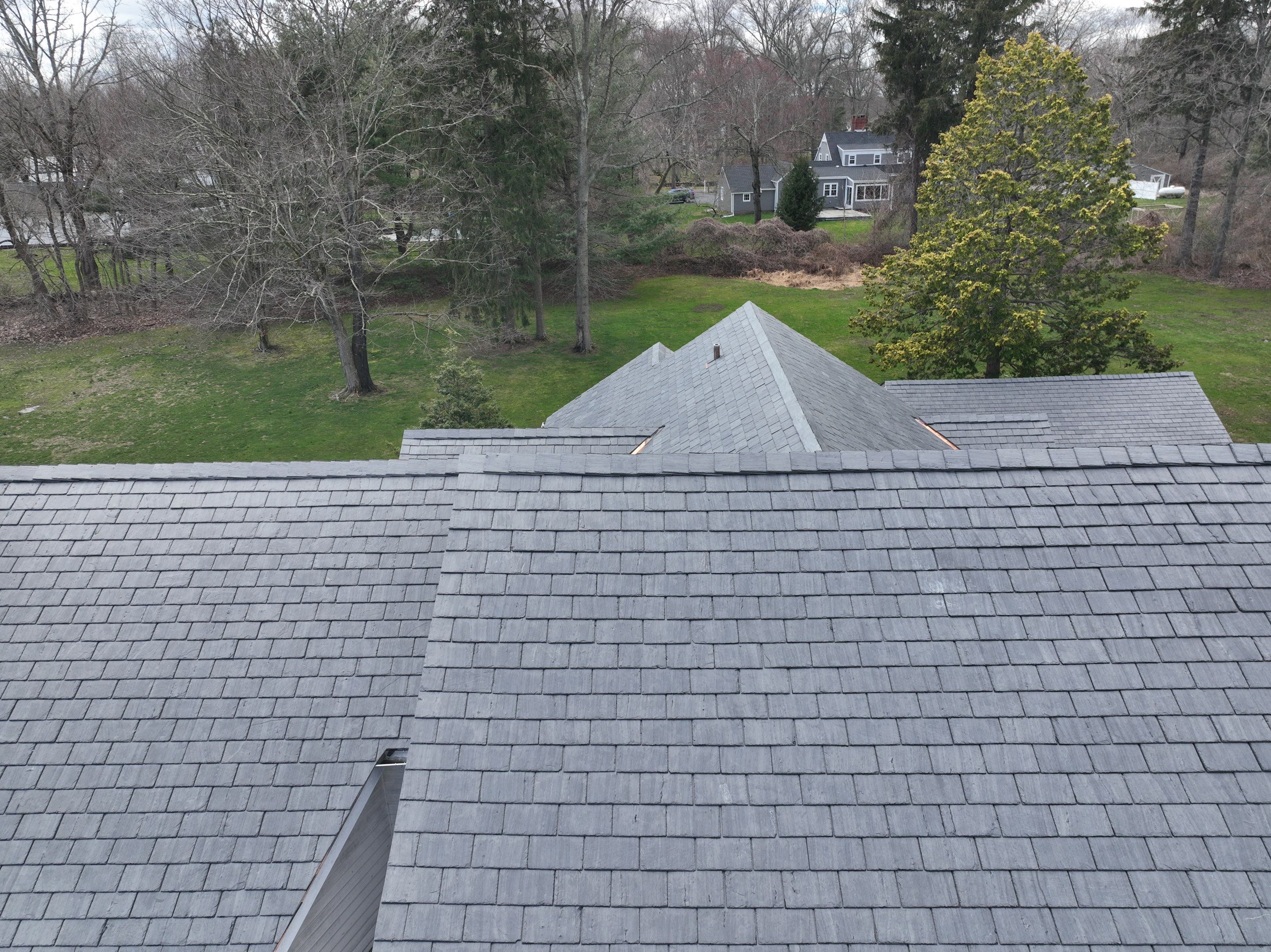 Residential Roofing Installation using Vermont Slate by A Plus Exterior