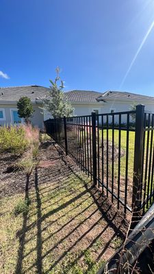 Aluminum Fence Installation using Black 3 Rail Aluminum Fence