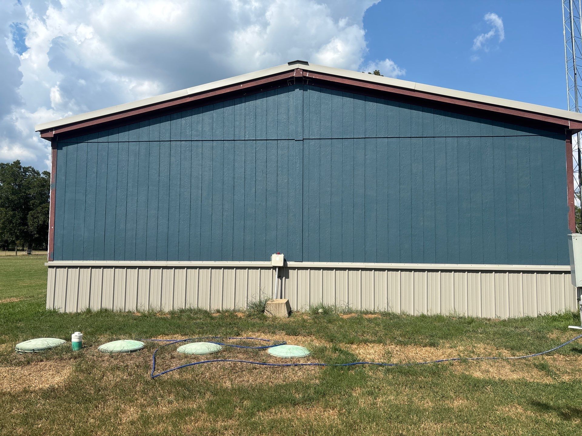 Exterior Painting in Fruitvale, TX | Wood Porch & Home in Deep Navy Blue by Quality Coats Painting