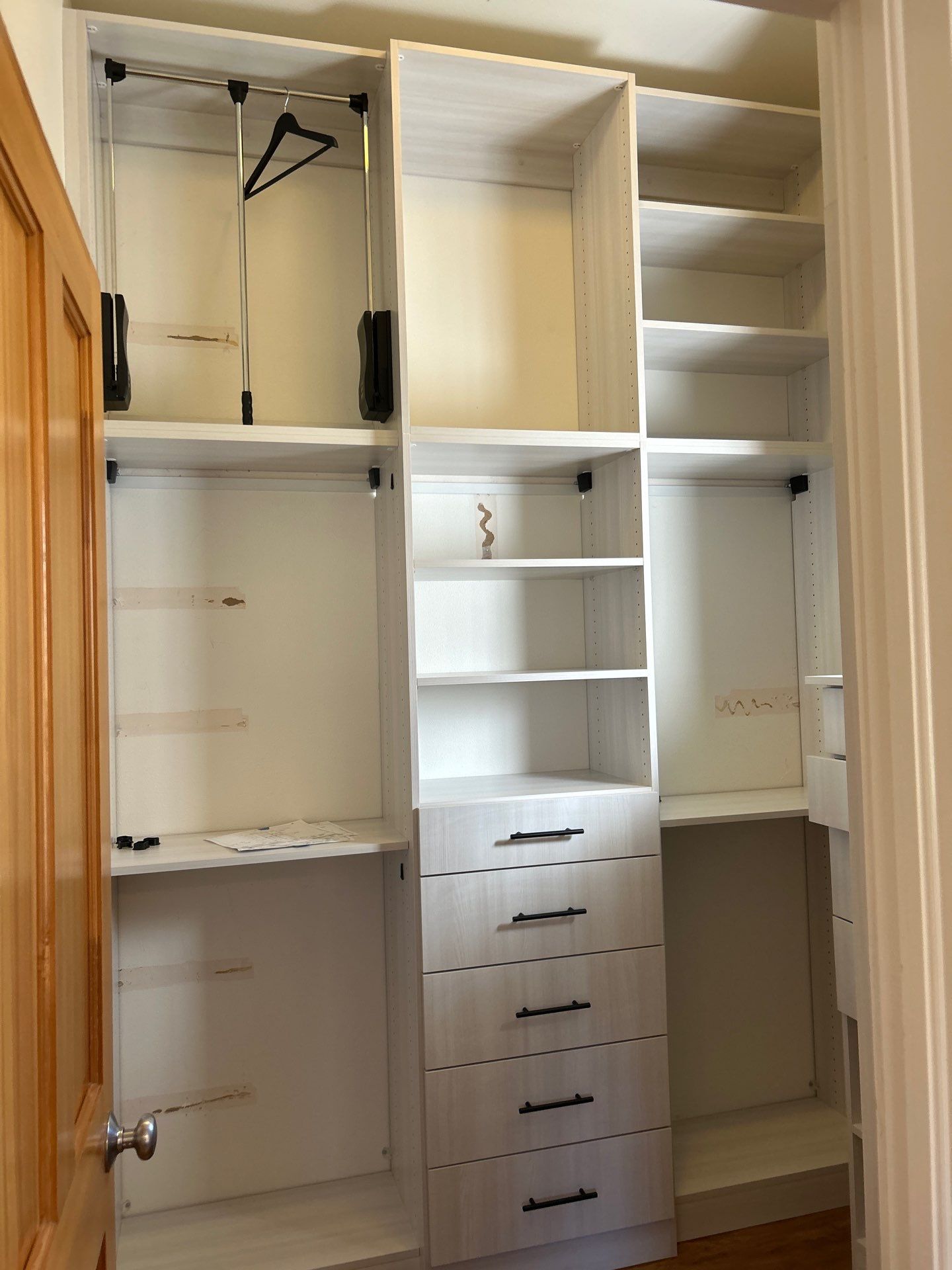 Walk-in Closet in a Small Space by Concept 32, Inc.