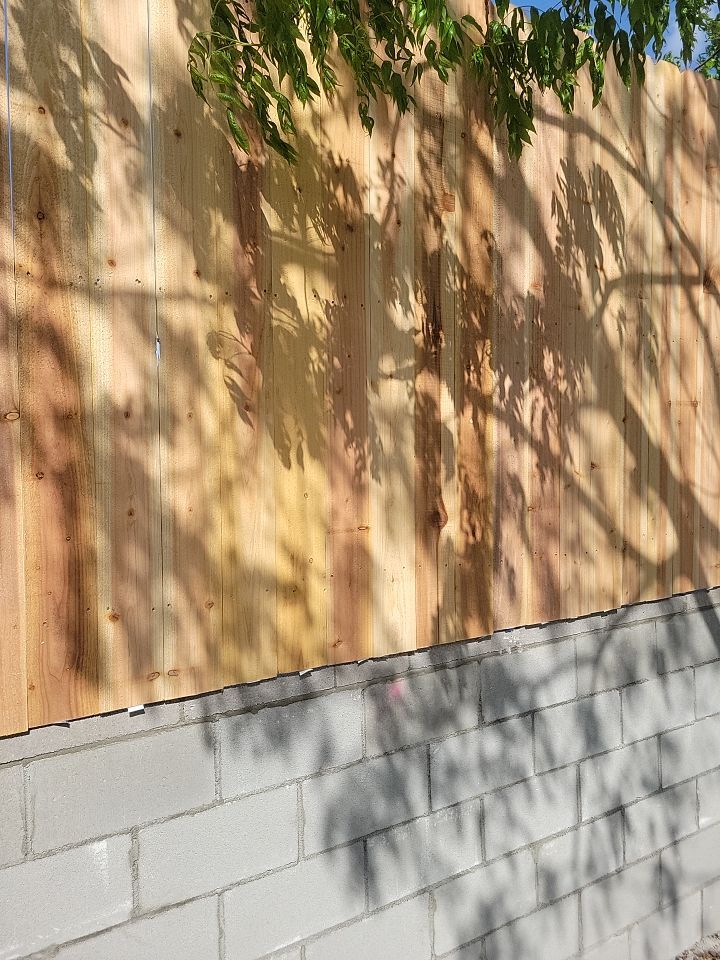 Cedar Fence using Cedar Pickets and Metal Poles by Clays Services Inc