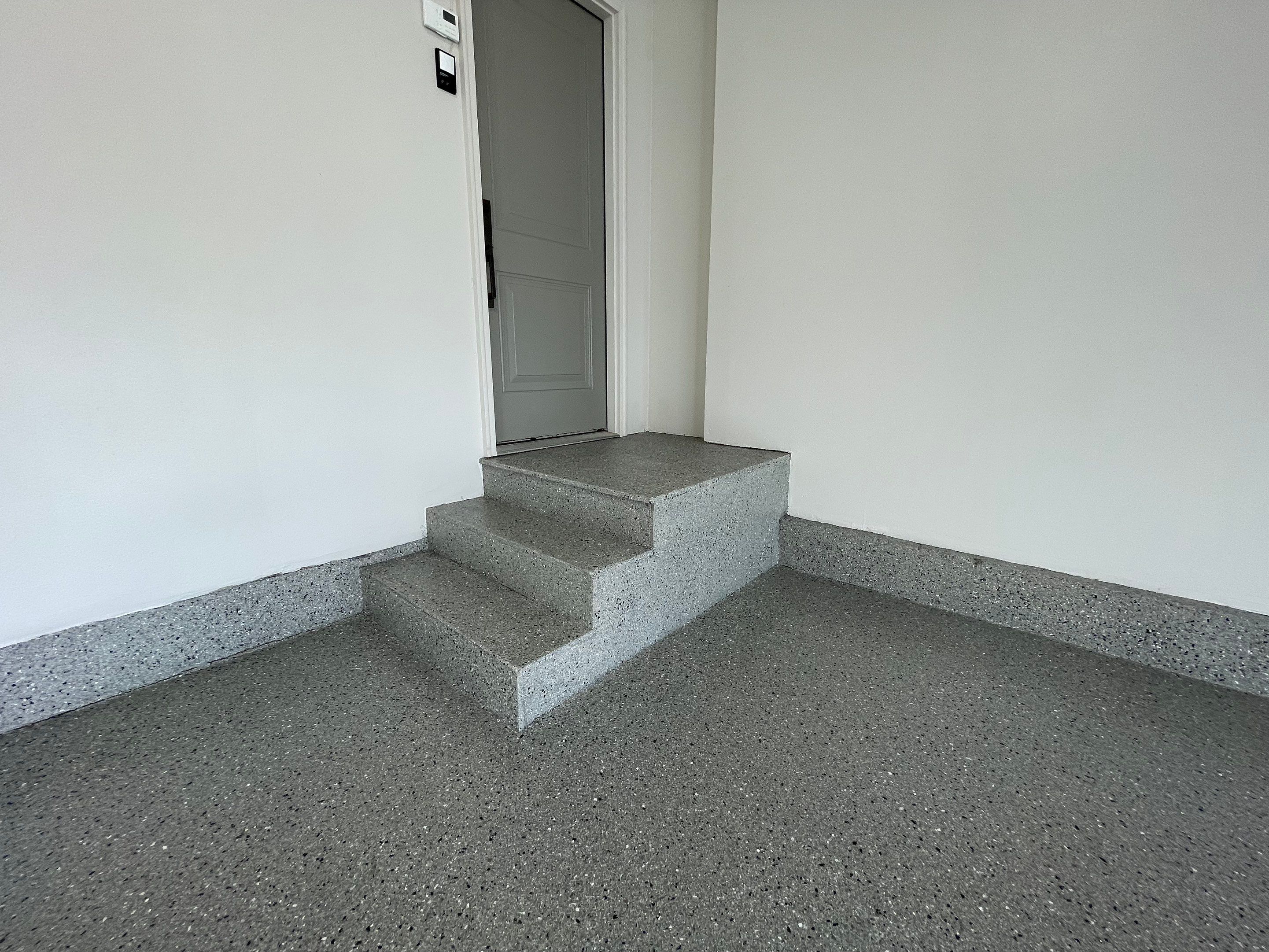 Residential Garage Floor Coating with Grey Speckled Epoxy Finish by Select Painting, Coatings & Garage Cabinets