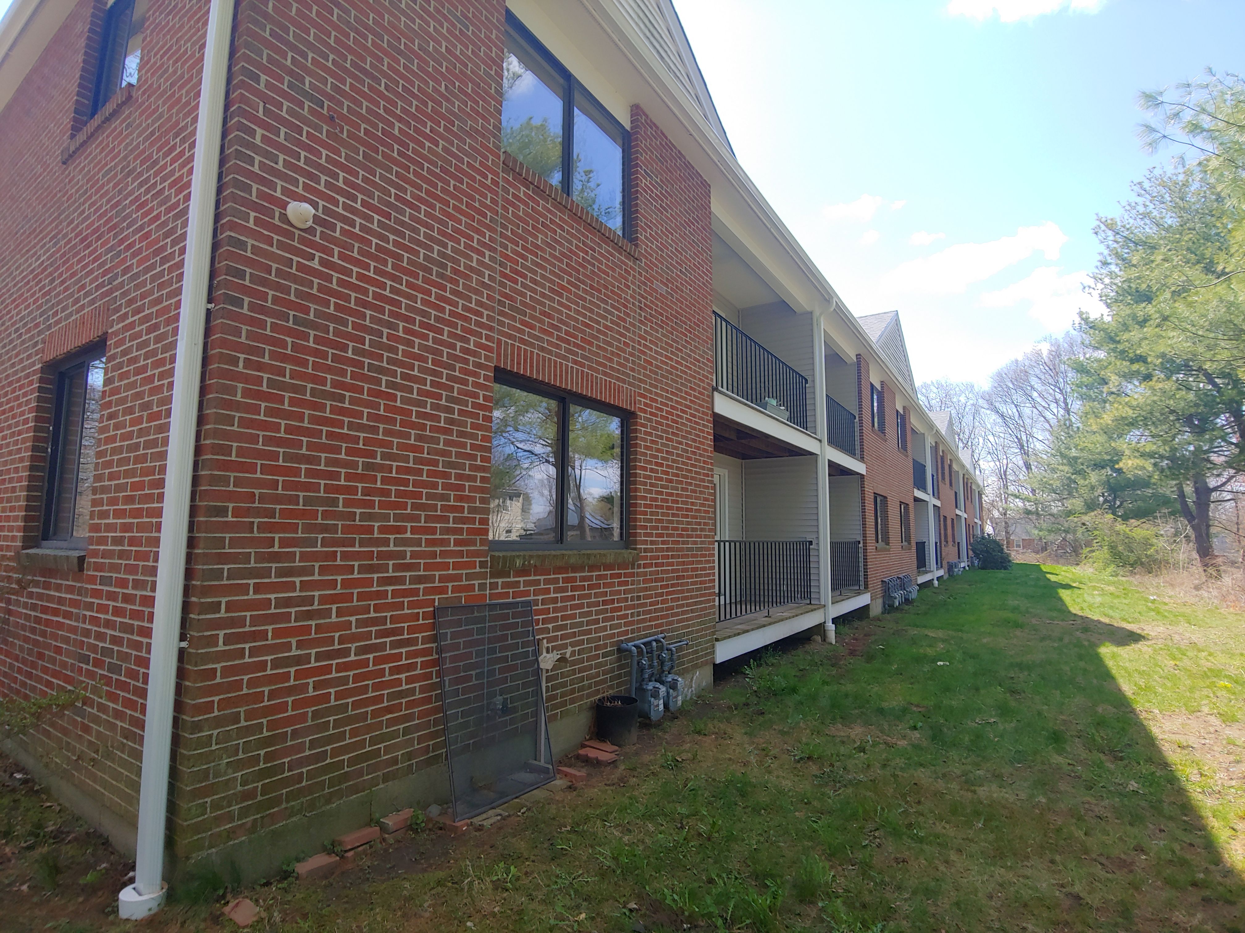 Commercial Roofing Installation using EPDM with white gutters by A Plus Exterior