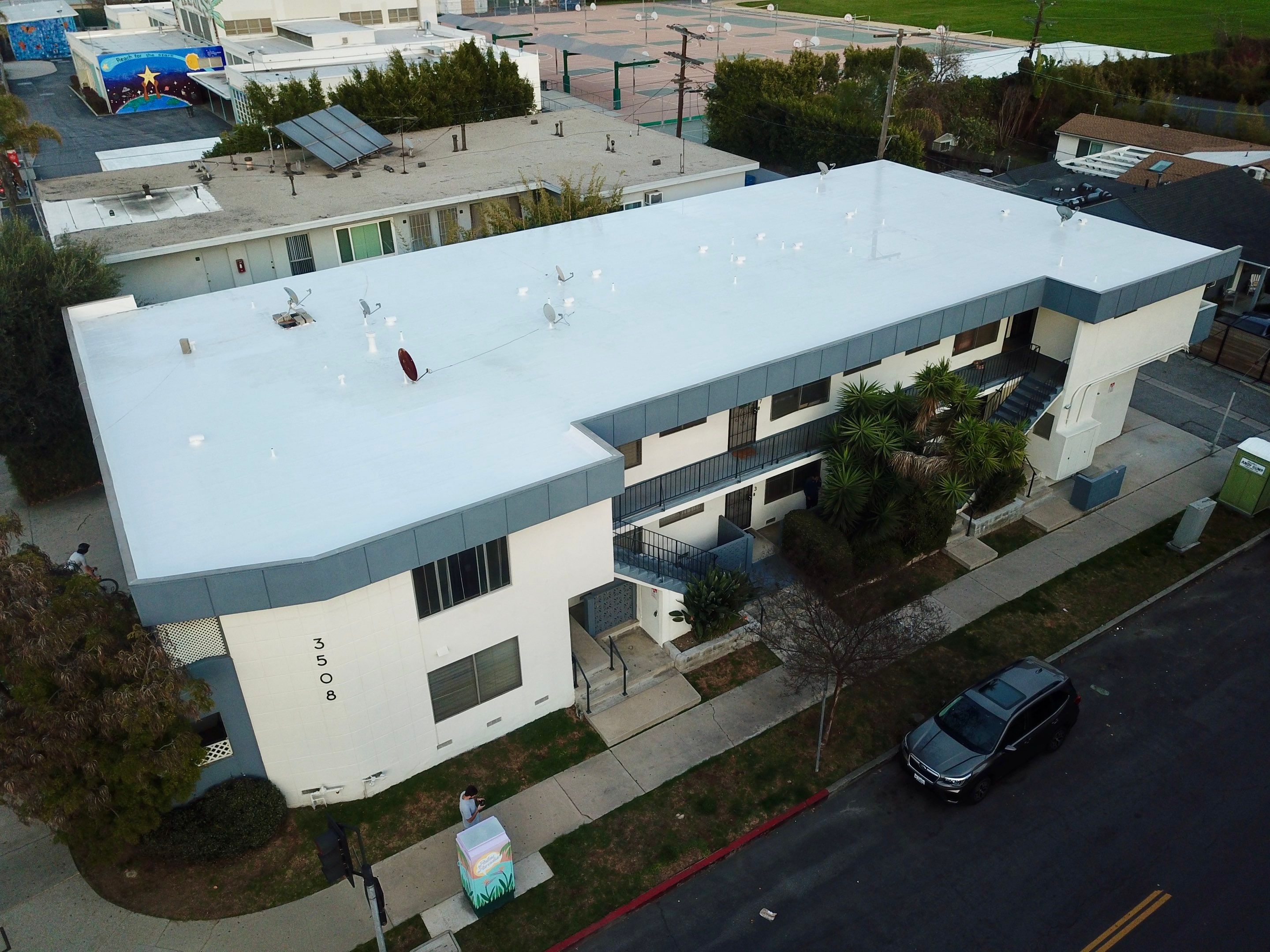 Apartment Building - Silicone Installation using ASC's Silicone Membrane by Hull Brothers Roofing