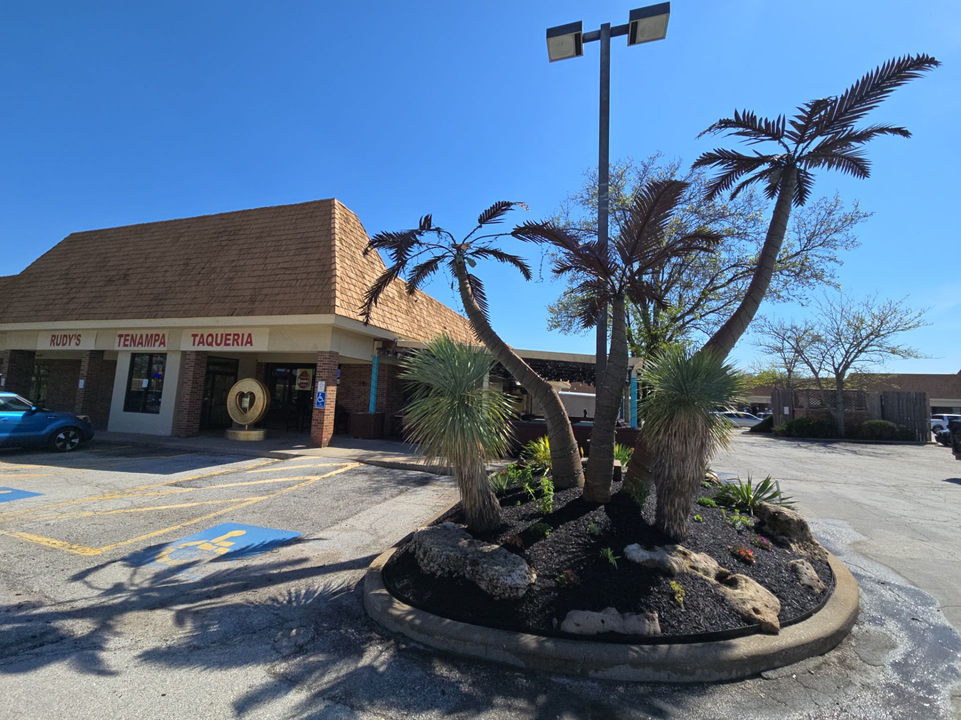 Restuarant Landscape Installation and Parking Lot Islands in Lenexa by LAND ESCAPES LLC