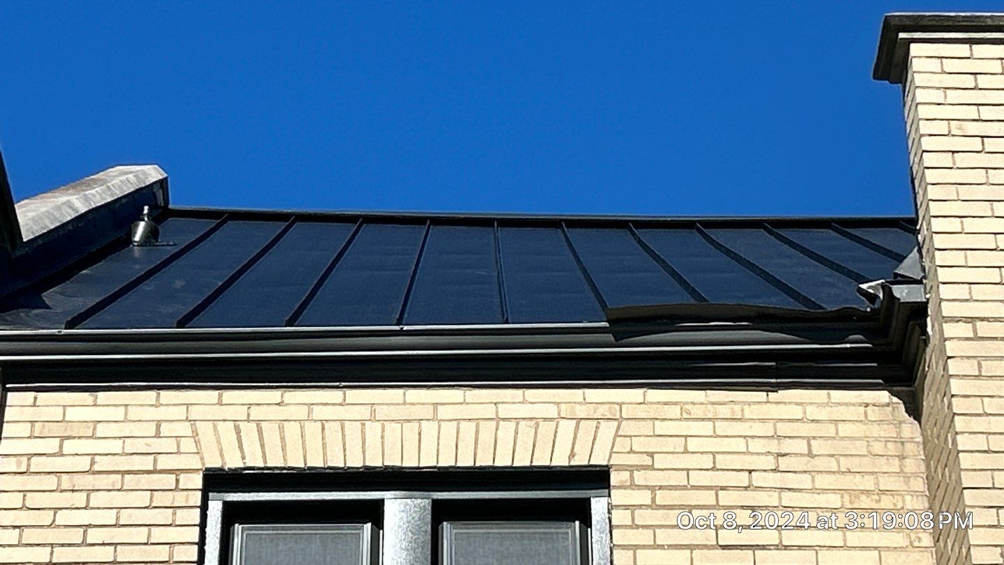 Commercial Roofing Installation using Standing Seam Metal - Frost Black by RoofX 