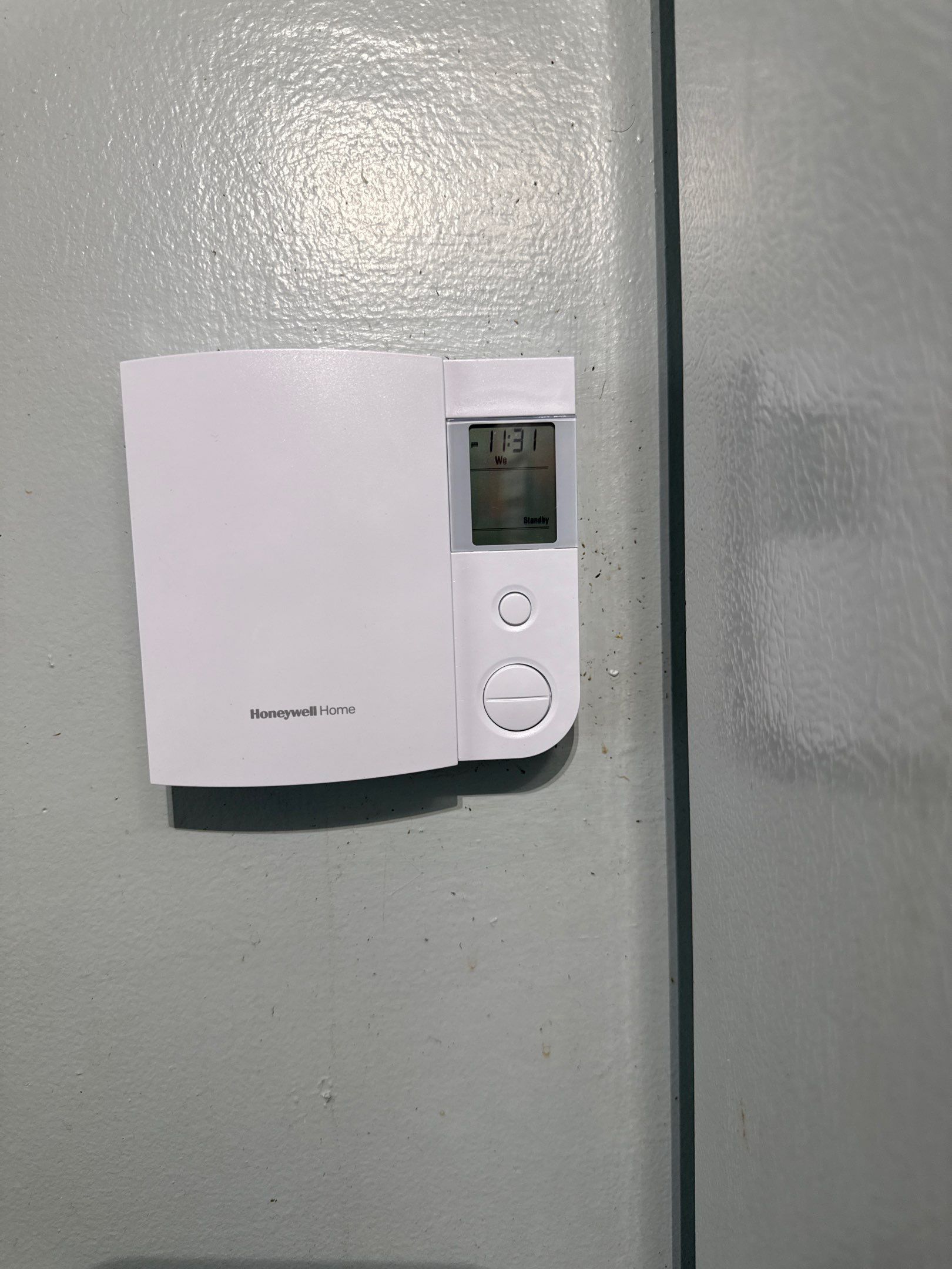 Thermostat Upgrade | Light Fixture Replacement  by Spartan Home Pros