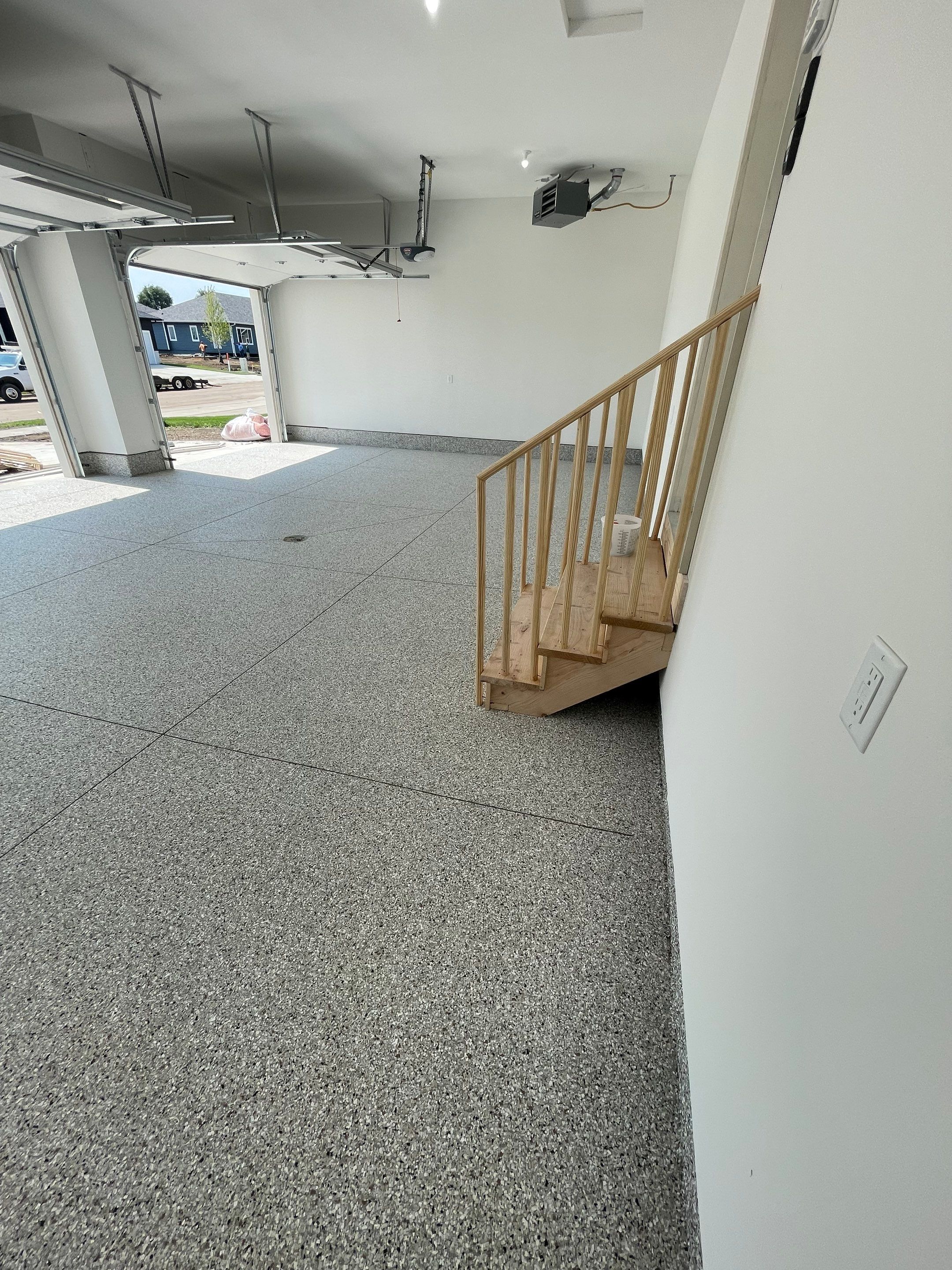 Grey Speckled Garage Floor Coating in Sioux Falls by Select Painting, Coatings & Garage Cabinets
