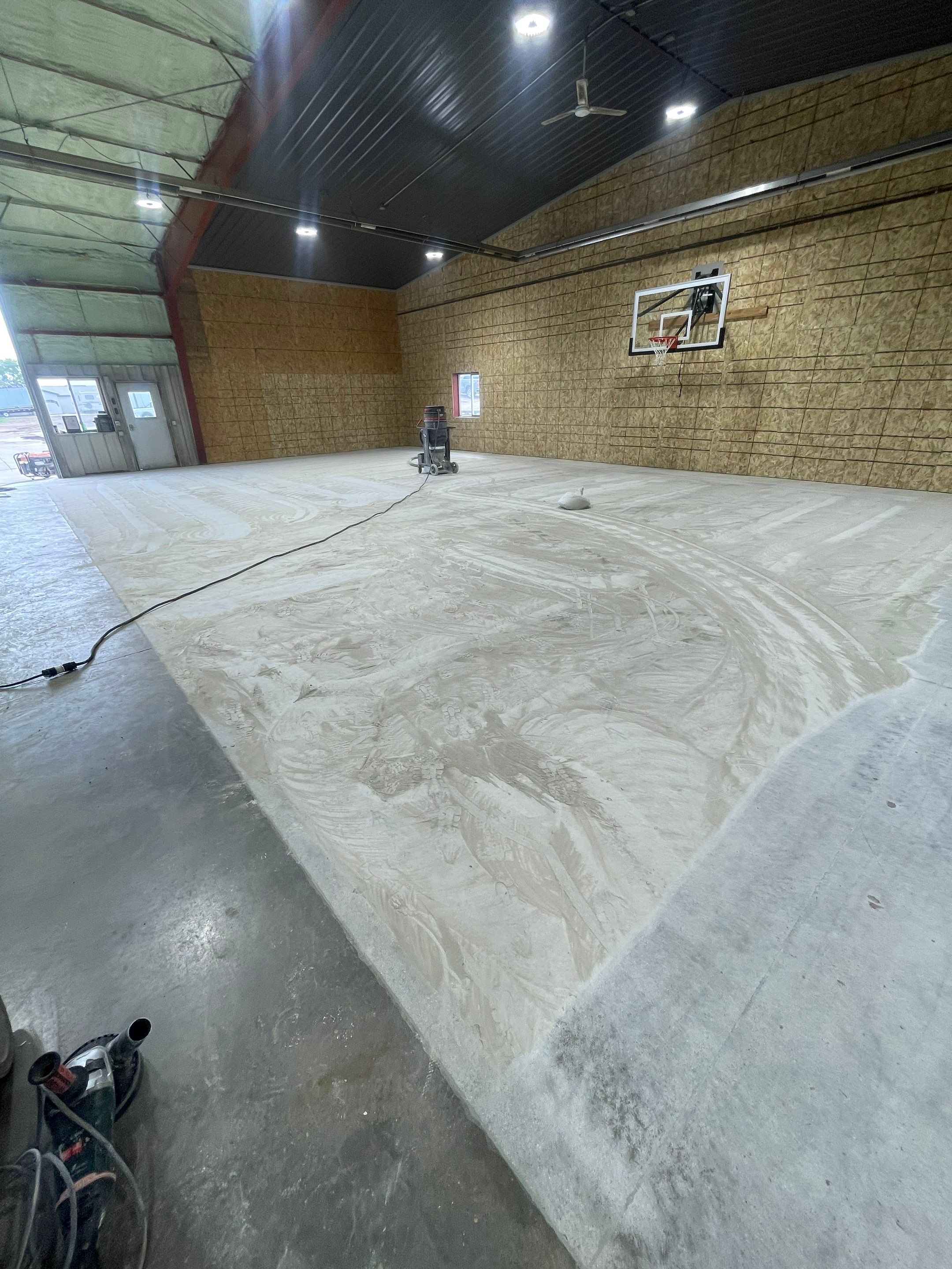 Custom Polyurea Shop Floor with Basketball Court Lines in Rock Valley by Select Painting, Coatings & Garage Cabinets
