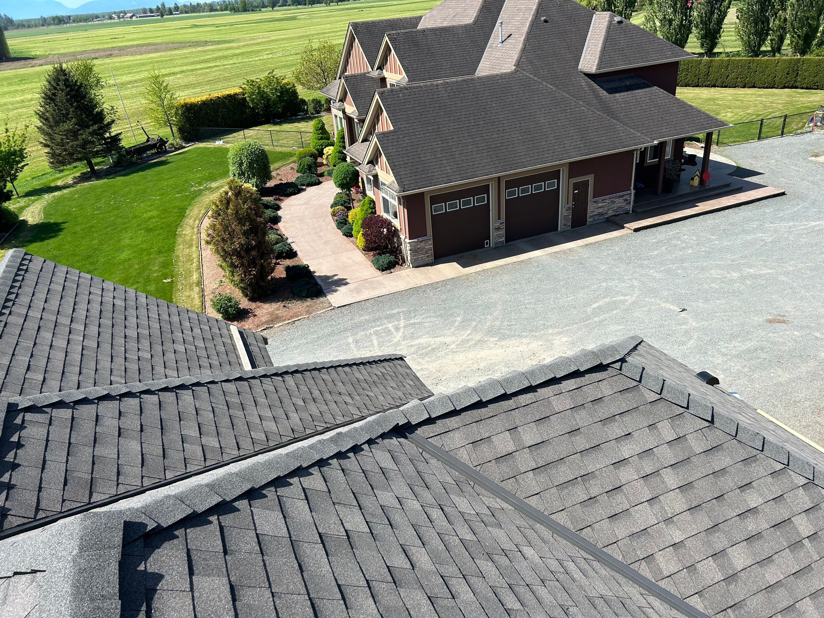 Residential Roofing Installation upgraded venting and hip and ridge capping by Top Notch Roofing Inc