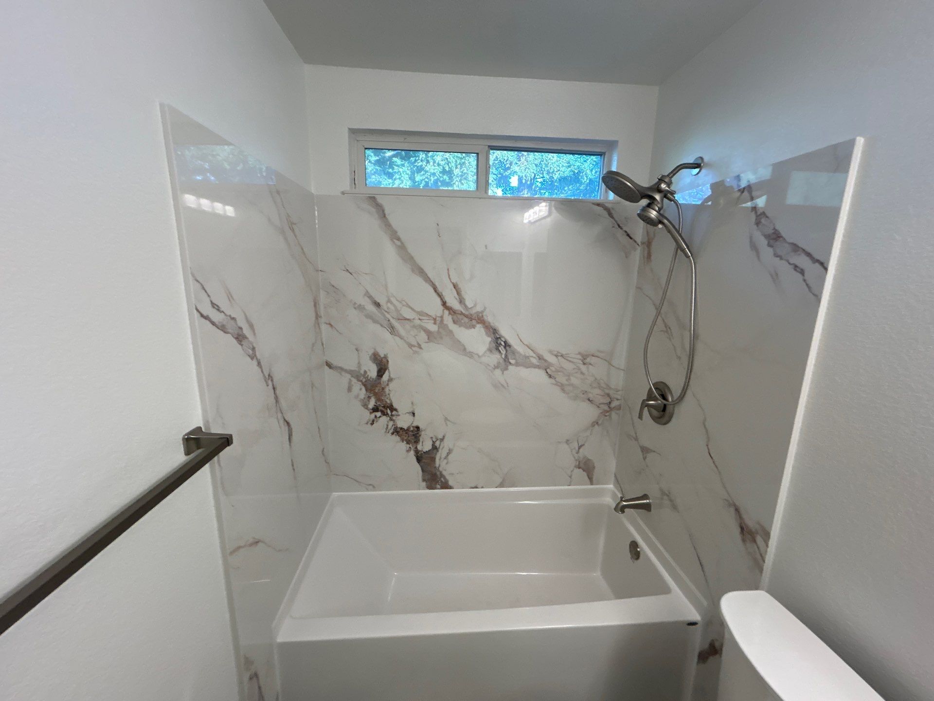 Bathroom Remodel Featuring Marble Stone Panels in Vacaville by H4H Remodeling and Repairs Inc.