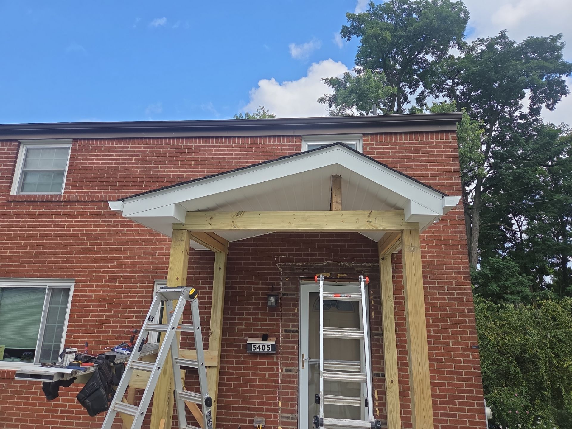 Concret and roof build  by Cousins Roofing Siding & Decks