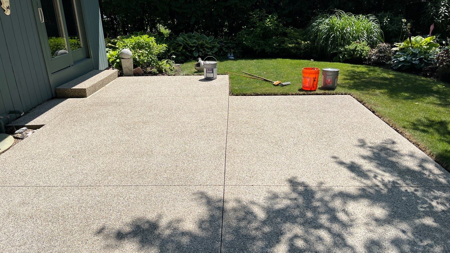 Aggregate concrete cleaning and sealing using Surebond SB-9000 by Northern Power Washing LLC.