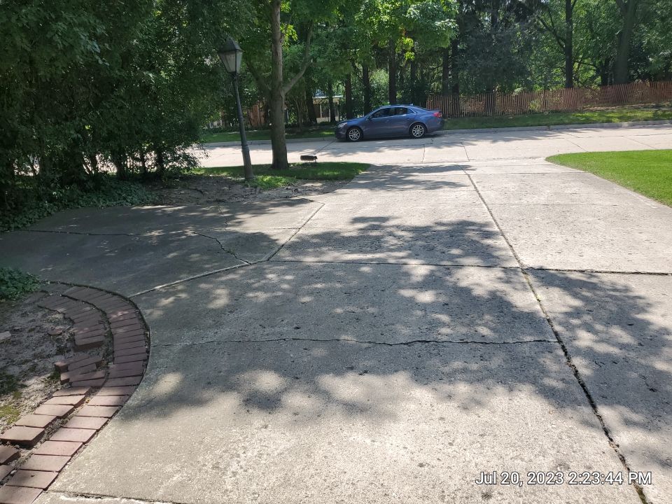 Aggregate concrete cleaning and sealing using Surebond SB-9000 by Northern Power Washing LLC.