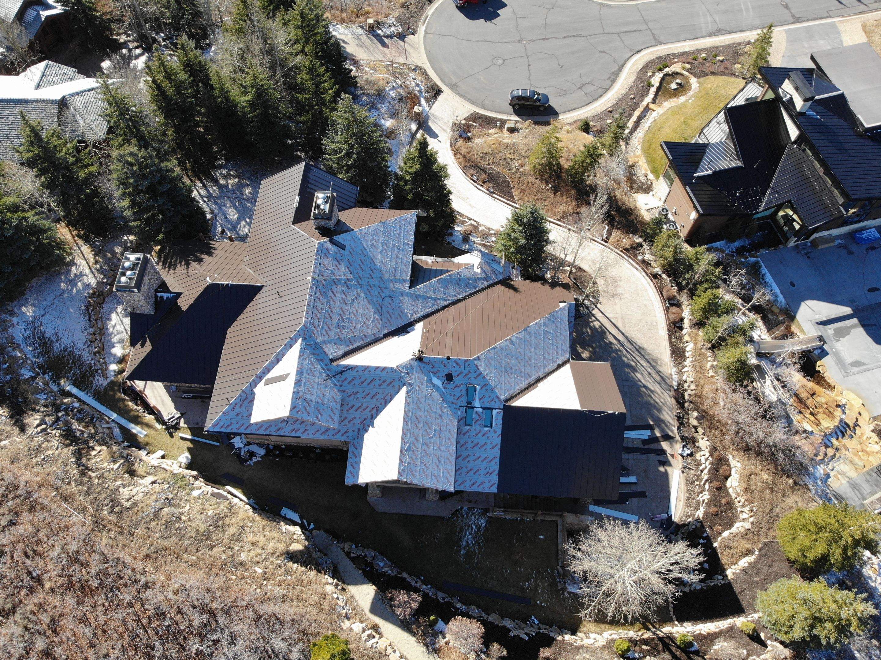 Standing Seam Metal Roof Replacement After Snow Damage by ASAP Roofing & Restoration